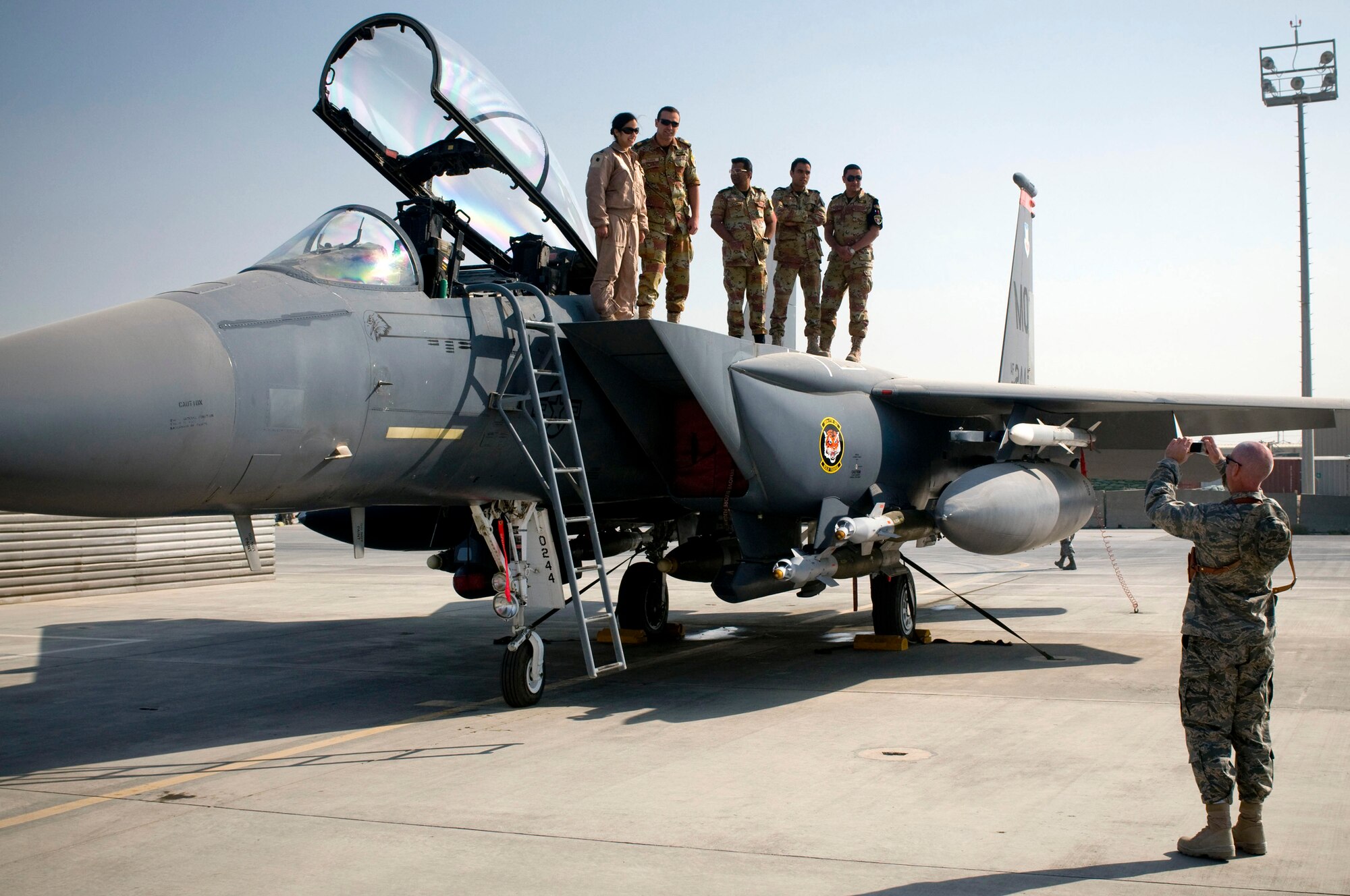 Capt. Sean Crean, 455th Expeditionary Operations Group, takes a group photo of Egyptian medical personnel with their F-15E Strike Eagle tour guide at Bagram Air Field, Afghanistan, Nov. 29. The Egyptians were very excited and grateful for having the opportunity to see American Air Power up close and personal. (U.S. Air Force photo by Staff Sgt. Samuel Morse)(Released)