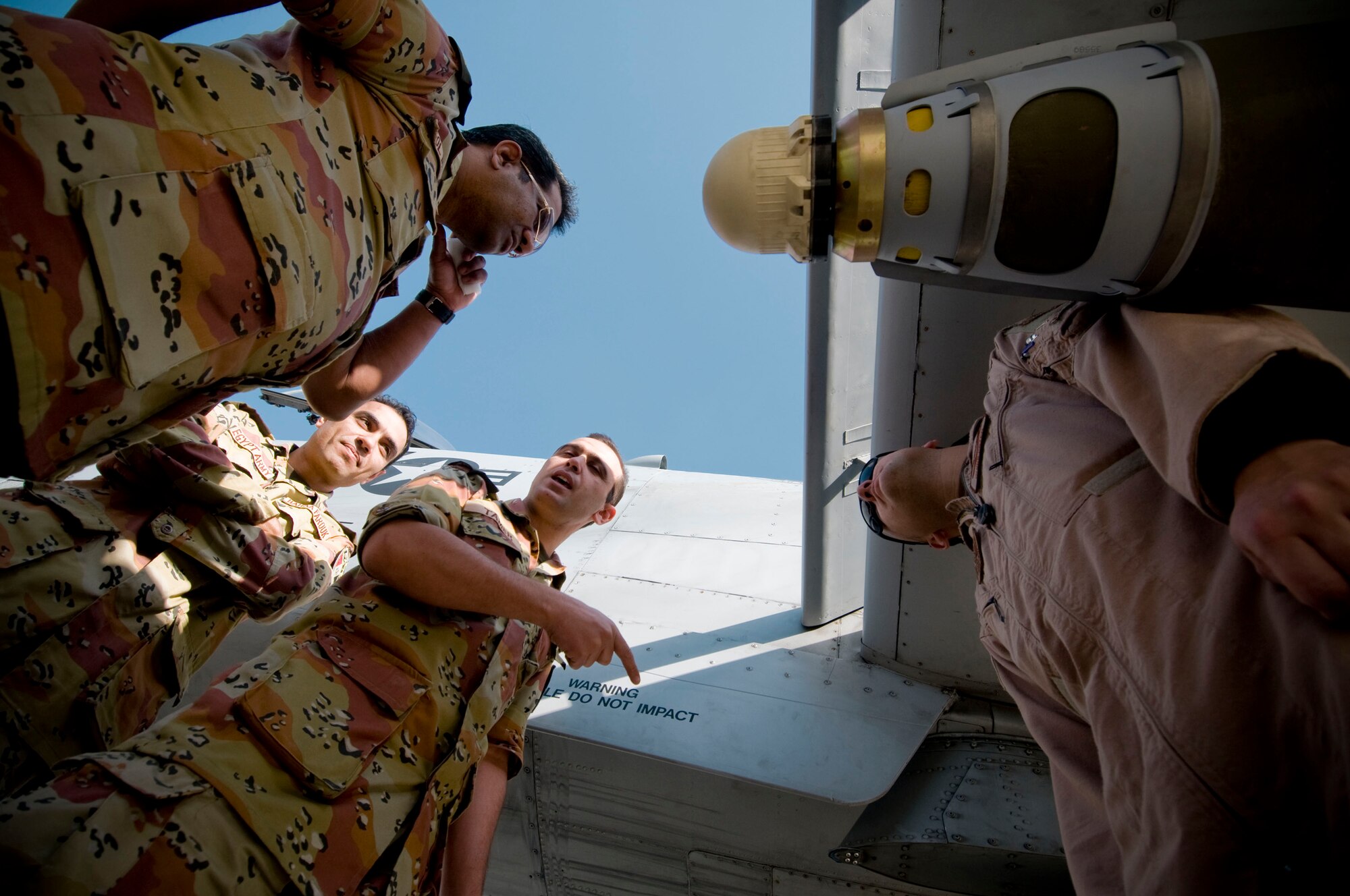 Egyptian Army medical personnel look at the bombs of an A-10 Thunderbolt II at Bagram Air Field, Afghanistan, Nov. 29. The Egyptians learned about the Air Force's close-air support mission for ground forces in Afghanistan. (U.S. Air Force photo by Staff Sgt. Samuel Morse)(Released)