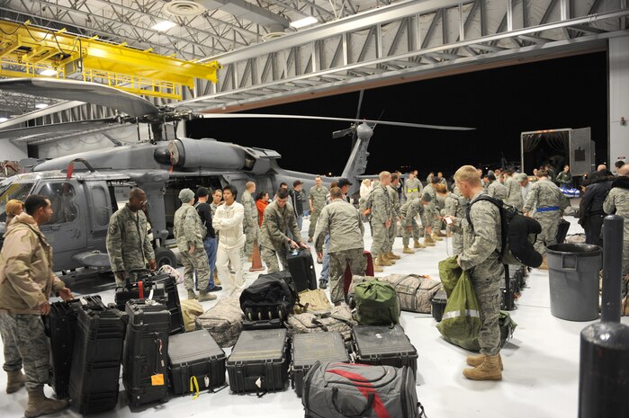 Members of the 763rd Maintenance Squadron unload equipment after returning from deployment at Nellis Air Force Base, Nev., Dec. 6, 2008. The 763rd MXS and 66th Rescue Squadron Airmen, return home after 3 1/2 months in Southwest Asia, supporting the Global War on Terrorism.
(U.S. Air Force Photo/Senior Airman Larry E. Reid Jr.)