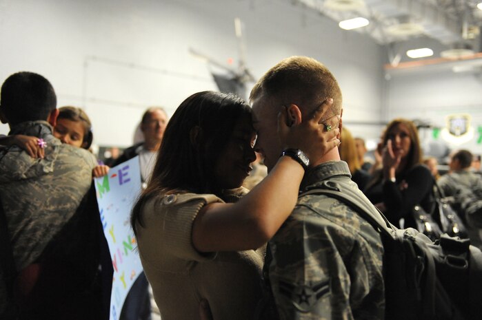 Airman 1st Class Daniel Rodgers, an HH-60 avionics specialist assigned to the 763rd Maintenance Squadron, embraces his wife Airman 1st Class Stephanie Rubi, a still photographic apprentice assigned to the 99th Air Base Wing at Nellis Air Force Base, Nev., Dec. 6, 2008. The 763rd MXS and 66th Rescue Squadron Airmen, return home after 3 1/2 months in Southwest Asia, supporting the Global War on Terrorism.
(U.S. Air Force Photo/Senior Airman Larry E. Reid Jr.)