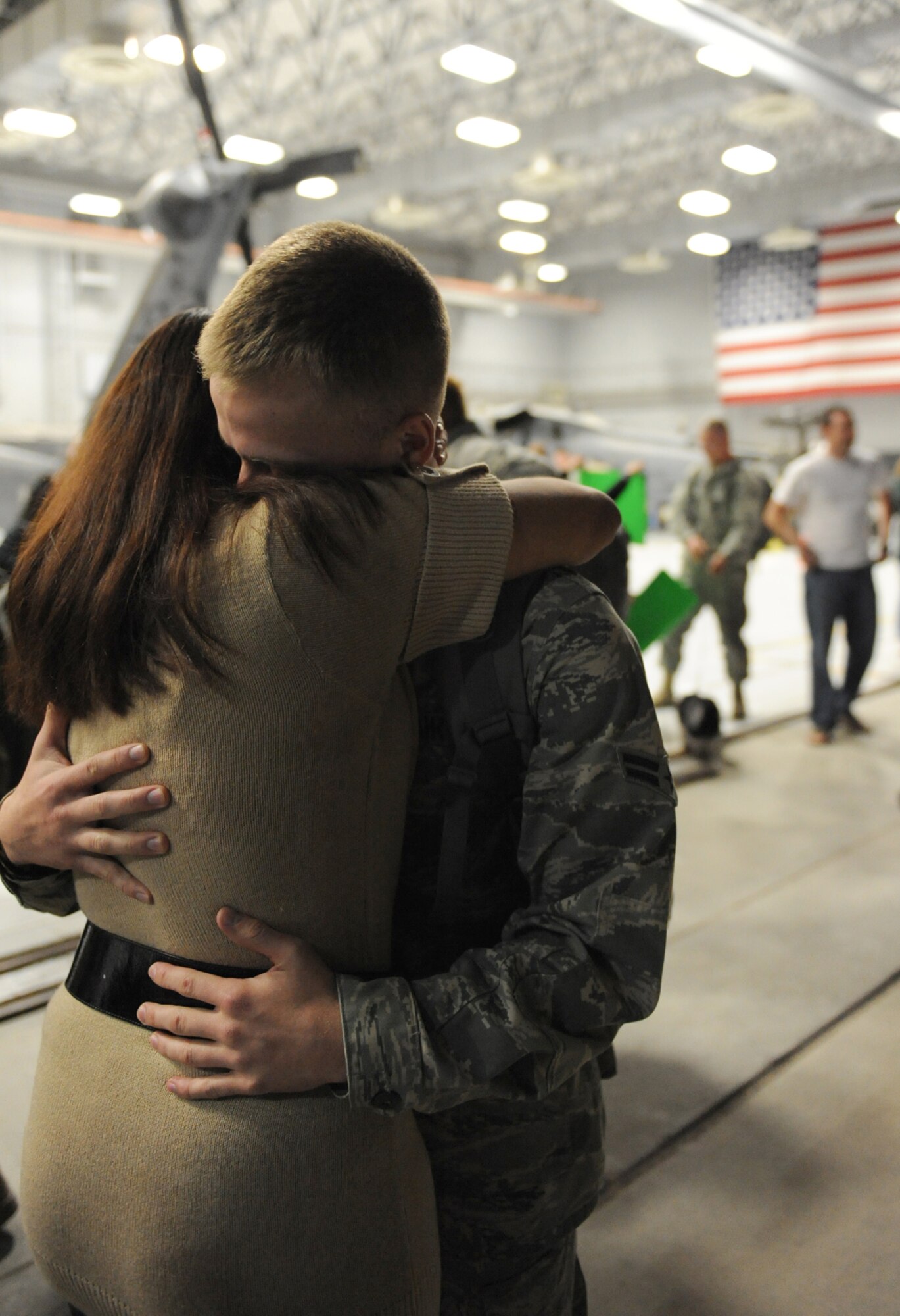 Airman 1st Class Daniel Rodgers, an HH-60 avionics specialist assigned to the 763rd Maintenance Squadron, embraces his wife Airman 1st Class Stephanie Rubi, a still photographic apprentice assigned to the 99th Air Base Wing at Nellis Air Force Base, Nev., Dec. 6, 2008. The 763rd MXS and 66th Rescue Squadron Airmen, return home after 3 1/2 months in Southwest Asia, supporting the Global War on Terrorism.
(U.S. Air Force Photo/Senior Airman Larry E. Reid Jr.)