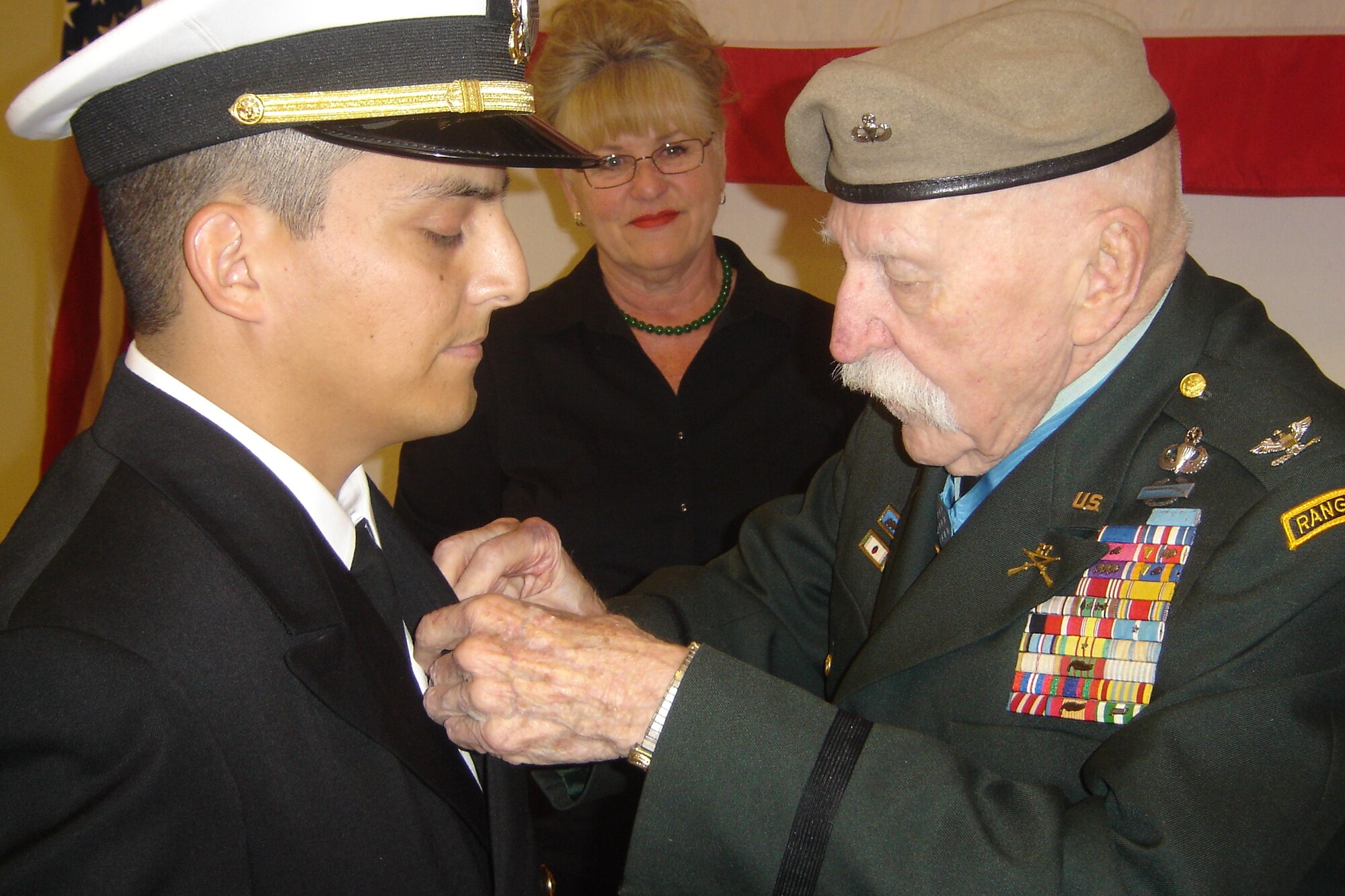 Medal of Honor recipient Col. Lewis L. Millett presents the Bronze Star to U.S. Navy Lieutenant Ed Giron, NOSC executive officer, for his service in Iraq. (U.S Air Force photo by Will Alexander)