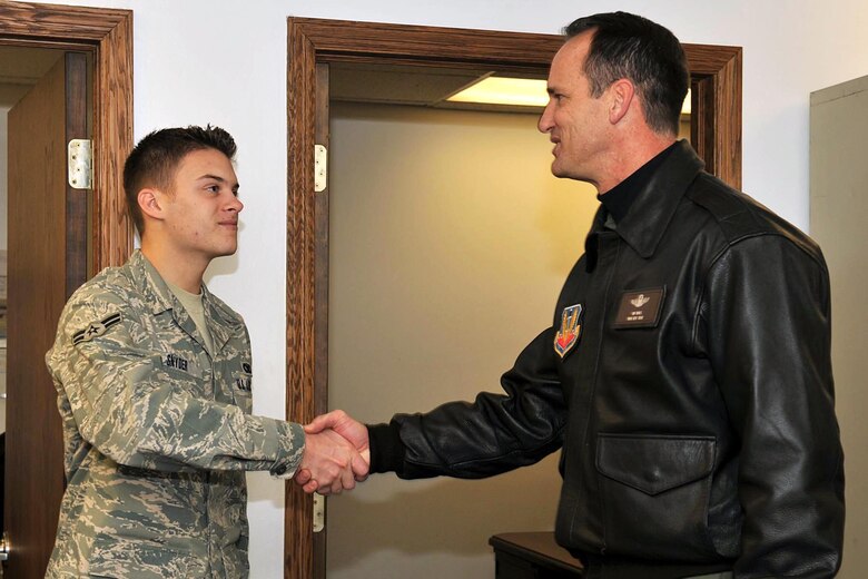 OFFUTT AIR FORCE BASE, Neb. -- Brig. Gen. James Jones, 55th Wing commander, speaks with Airman 1st Class Micheal Snyder, 55th Wing Honor Guard, as he tours the Martin Bomber Building Dec. 4. The building has undergone extensive cleanup efforts since March in order to improve the work environment for many military and civilian members of Team Offutt. This historic building consists of 1.5 million square feet and was used as a plant for B-26 Marauder Bombers and B-29 Superfortress Bombers during World War II. (U.S. Air Force Photo By Charles Haymond)