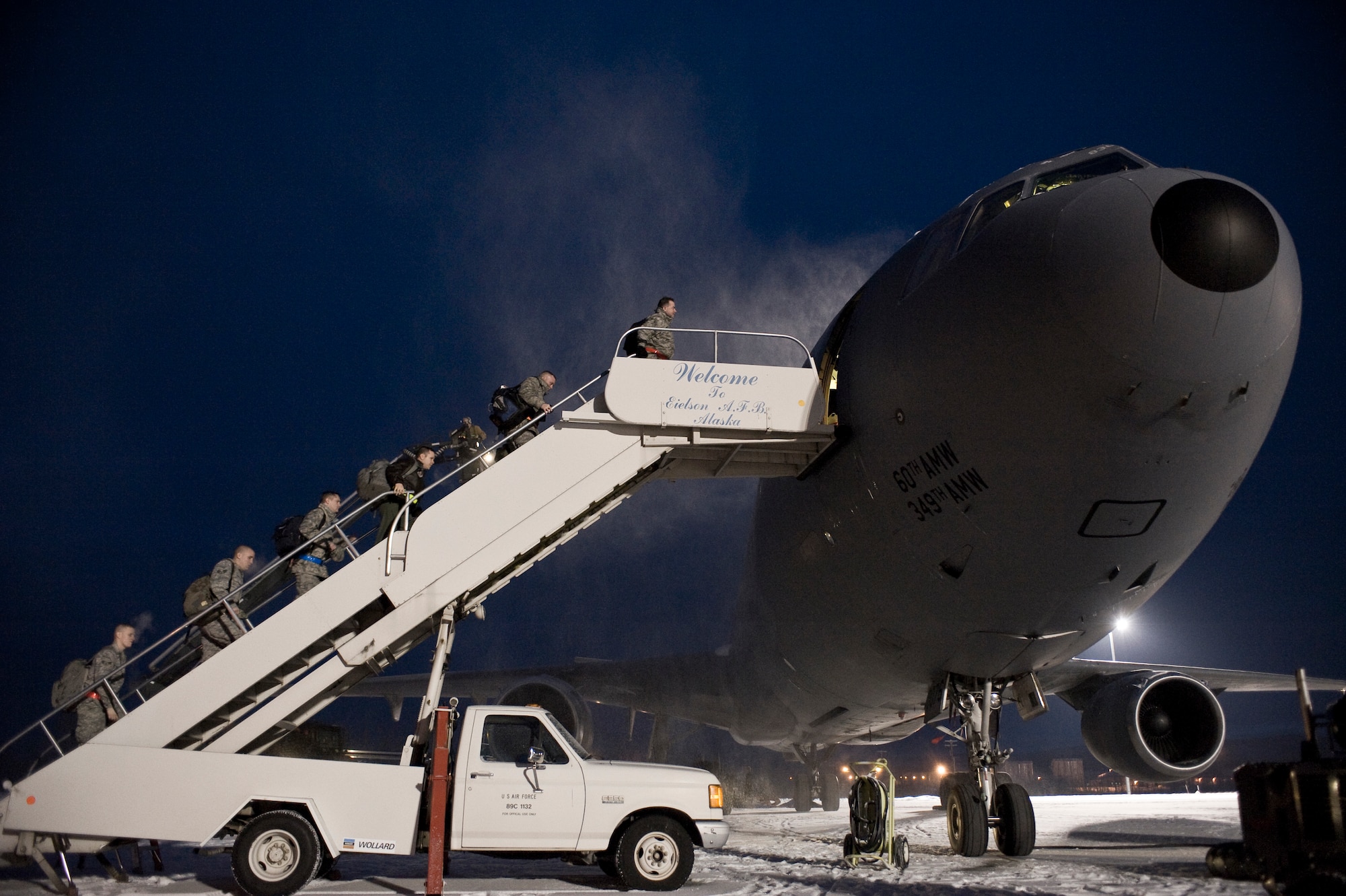 Airmen of the 354th Aircraft Maintenance Squadron board a KC-10 Extender prior to their departure for the Aggressor road-show only to be delayed Dec. 4, 2008, at Eielson Air Force Base, Alaska. They left for Hickam Air Force Base, Hawaii, two days later. While there, the 18th Aggressor Squadron will provide expert threat academics to teach 199th Fighter Squadron on air threats, systems and potential threats in simulated air-combat sorties.  (U.S. Air Force photo/Senior Airman Jonathan Snyder)