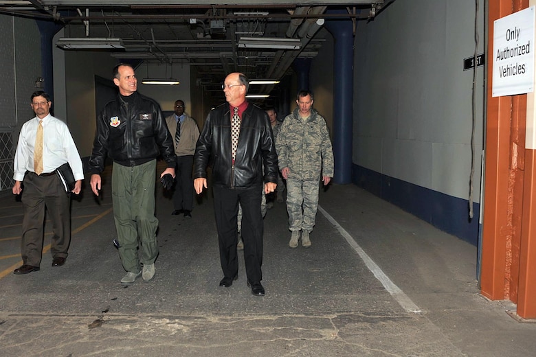 Mr. Cecil Weeks, 55th Civil Engineer Squadron chief of operations and maintenance, leads Brig. Gen. James Jones, 55th Wing Commnader,Col. Thomas Goffus, Mission Support Group commander, and Mr. Mark Jacobsen, 55th Civil Engineer Sqaudron director of engineering, through the Martin Bomber Building Dec. 4. The building has undergone extensive cleanup efforts since March in order to improve the work environment for many military and civilian members of Team Offutt. This historic building consists of 1.5 million square feet and was used as a plant for B-26 Marauder Bombers and B-29 Superfortress Bombers during World War II.   (U.S. Air Force Photo By Charles Hammond)