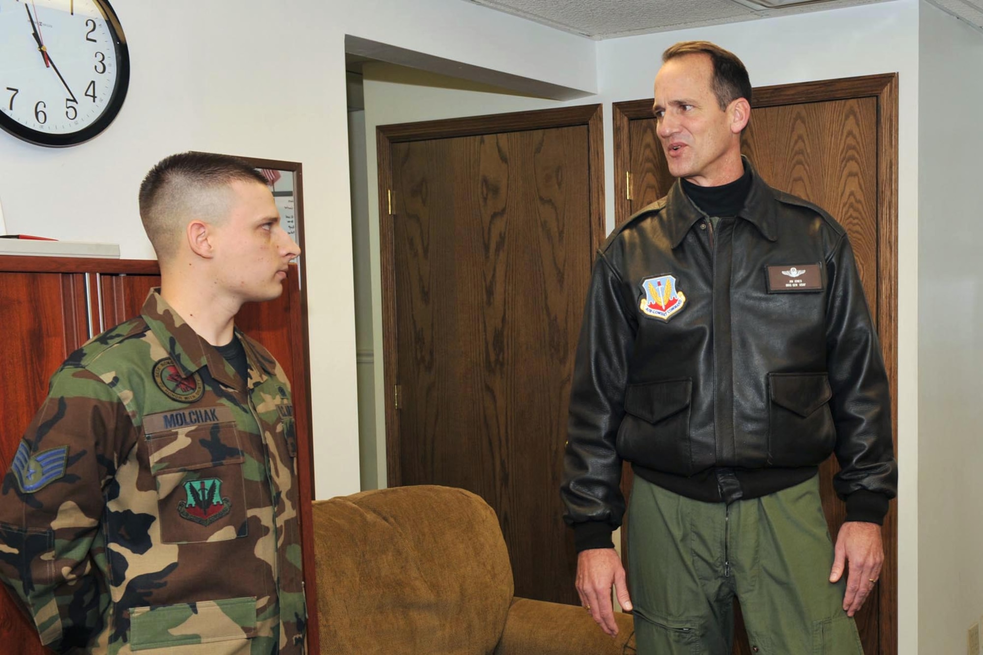 OFFUTT AIR FORCE BASE, Neb. -- Brig. Gen. James Jones, 55th Wing commander, dicusses the recent cleanup efforts at the Martin Bomber Building with Staff Sgt. Aaron Molchak, 55th Wing Honor Guard non-commissioned officer in charge. The building has undergone extensive cleanup efforts since March in order to improve the work environment for many military and civilian members of Team Offutt. This historic building consists of 1.5 million square feet and was used as a plant for B-26 Marauder Bombers and B-29 Superfortress Bombers during World War II.  (U.S. Air Force Photo By Charles Hammond)