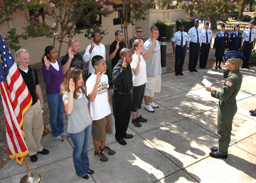 Colonel Maryanne Miller 349th Air Mobility Wing commander, swears in new Air Force members during a mass enlistment held at Travis Air Force Base, California. (USAF photo by Civ/ Nan Wylie) (Released)