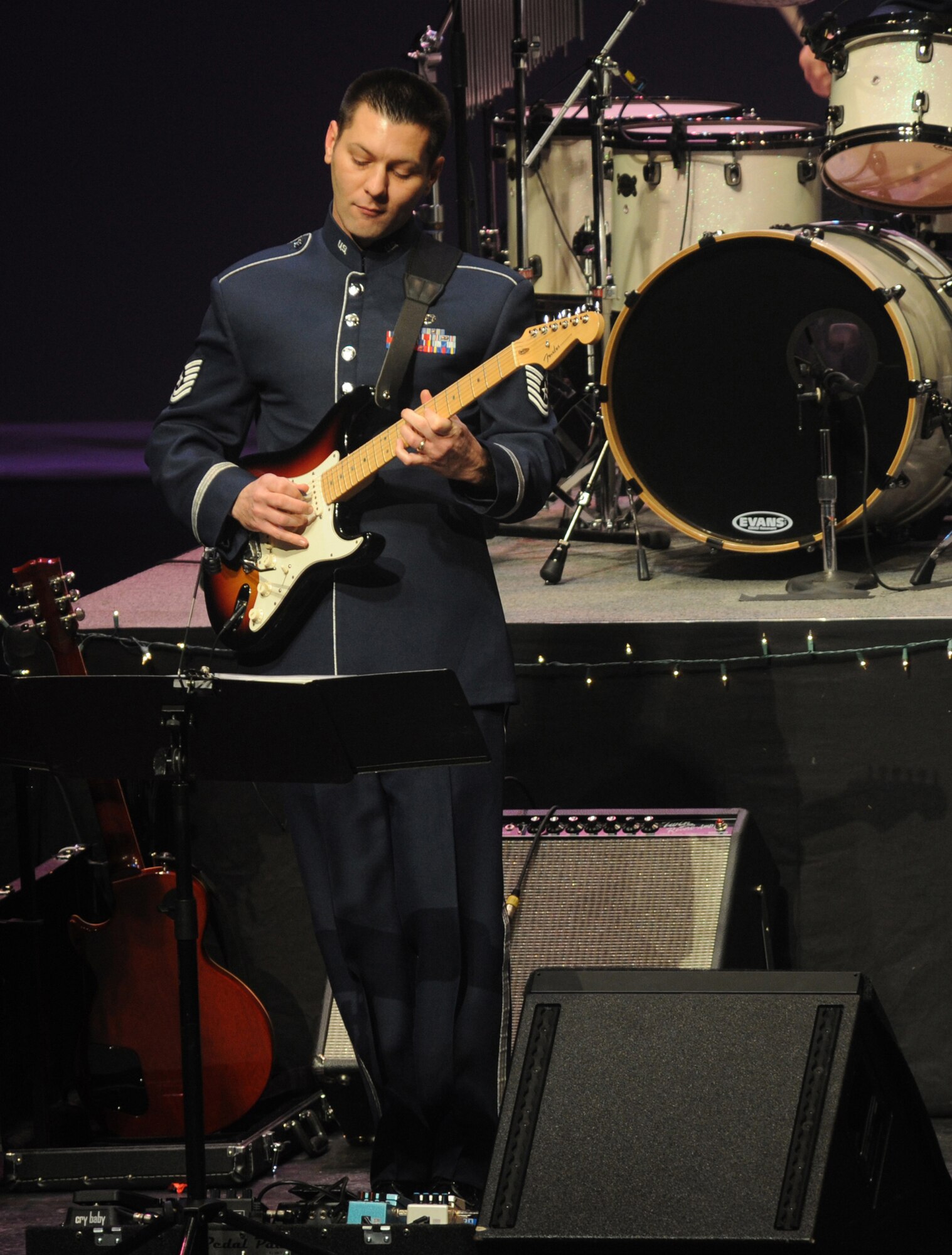 ELMENDORF AIR FORCE BASE, Alaska -- Tech. Sgt. Rick Baisden, U.S. Air Force Band of the Pacific, performs a guitar solo during the song "What Christmas Means to Me" during Sounds of the Season Dec. 3. Sounds of the Season is an Air Force Band concert that is open to the public during the holiday season. The concert was performed Dec. 3 and 4 at the Atwood Concert Hall in Anchorage. (U.S. Air Force photo/Senior Airman Matthew Owens)