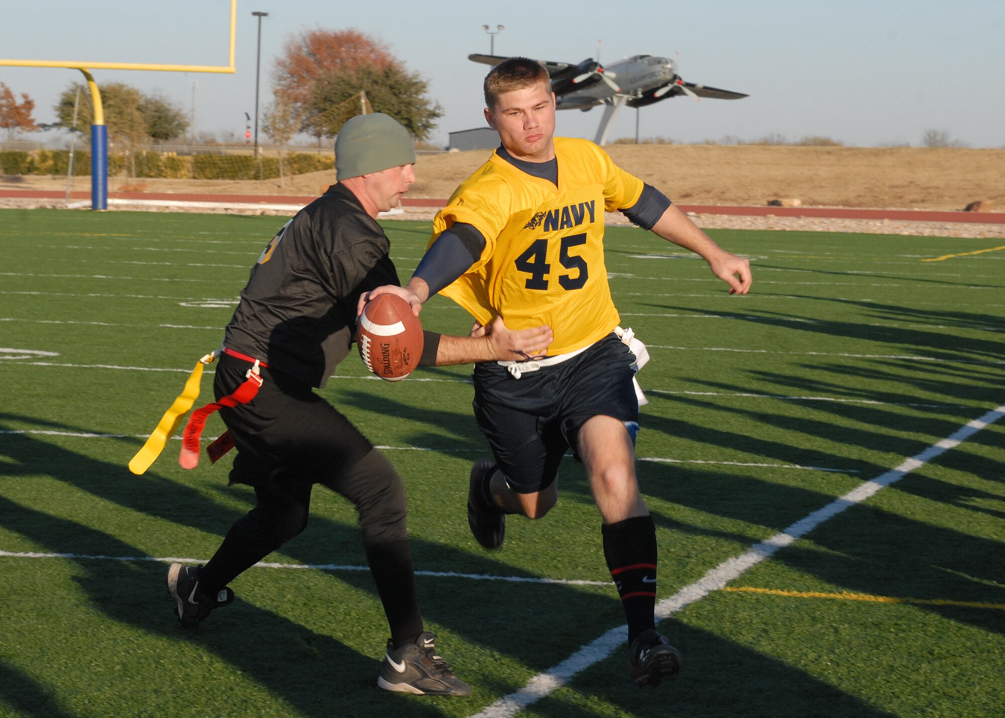 A Navy player is forced out of bounds during the annual Army vs. Navy flag football game at Goodfellow Air Force Base on Dec. 5.  Navy defeated Army for the first time in 5 years with a score of 49-47.  (U.S. Air Force photo by Senior Airman Kasabyan Musal).
