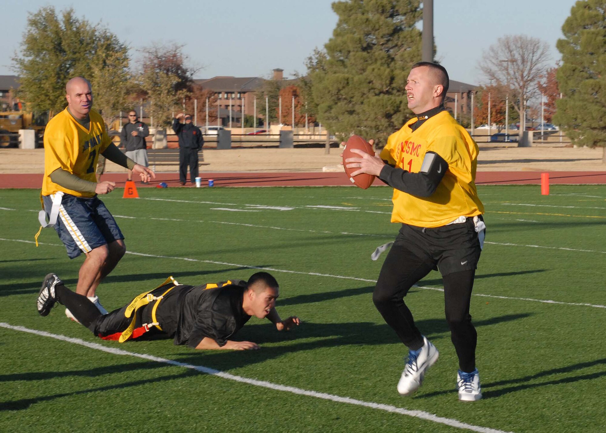 A Navy player makes a drive downfield during the annual Army vs. Navy flag football game at Goodfellow Air Force Base on Dec. 5.  Navy defeated Army for the first time in 5 years with a score of 49-47.  (U.S. Air Force photo by Senior Airman Kasabyan Musal).