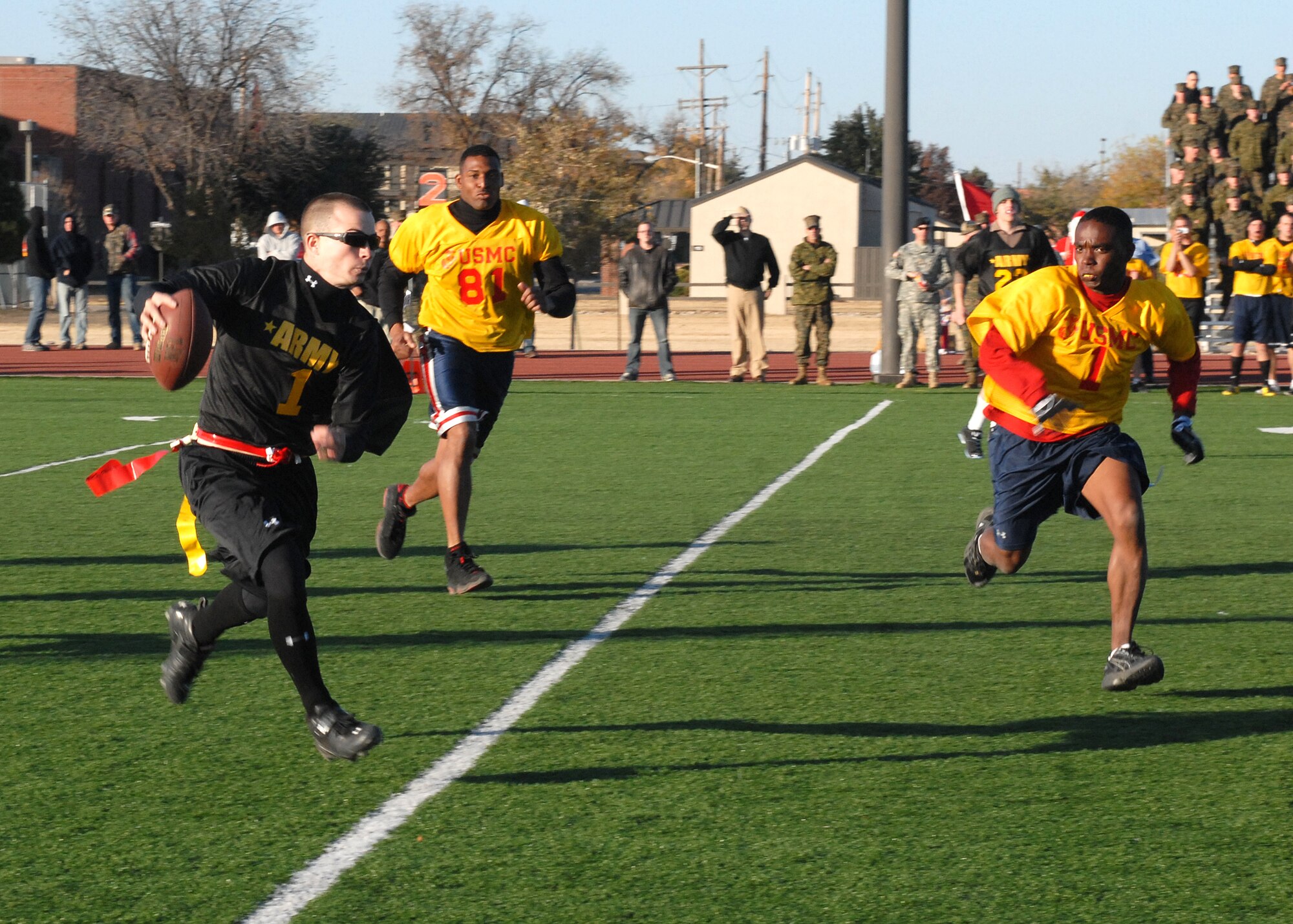 The Army quarterback makes a break down the field during the annual Army vs. Navy flag football game at Goodfellow Air Force Base on Dec. 5.  Navy defeated Army for the first time in 5 years with a score of 49-47.  (U.S. Air Force photo by Senior Airman Kasabyan Musal).
