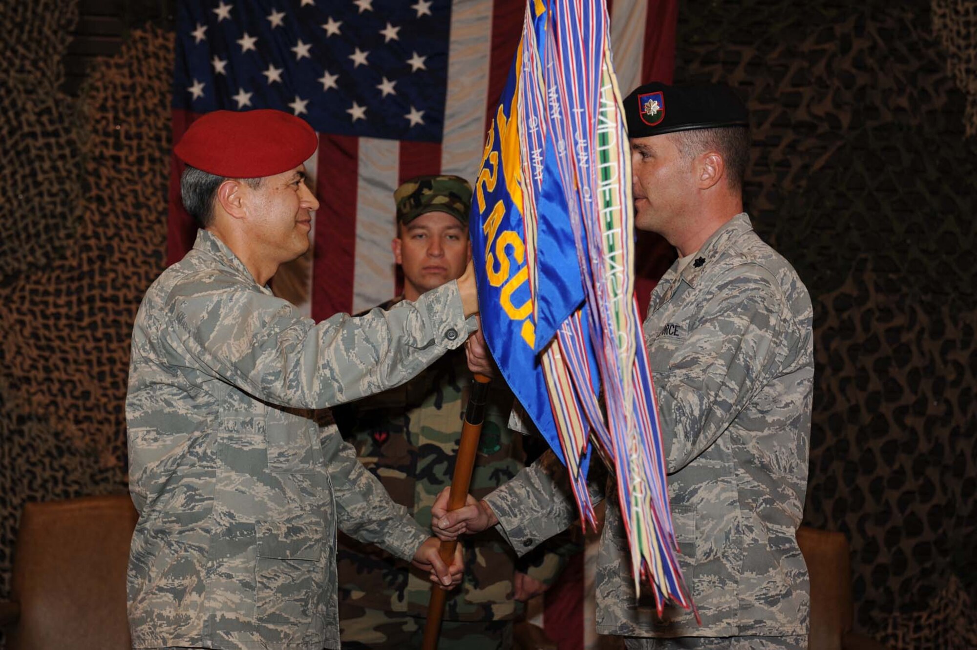SHAW AIR FORCE BASE, SC -- Lieutenant Colonel Dale P. Sinnott accepts command of the 682nd Air Support Operations Squadron from Col Patrick P. Pihana, 18th Air Support Operations Group commander, during the 682nd Change of Command on December 5, 2008. Lt Col Sinnott recieved command of the 682nd ASOS from Lt Col Kenneth B. Craib. (U.S. Air Force photo/Senior Airman Matthew Davis)