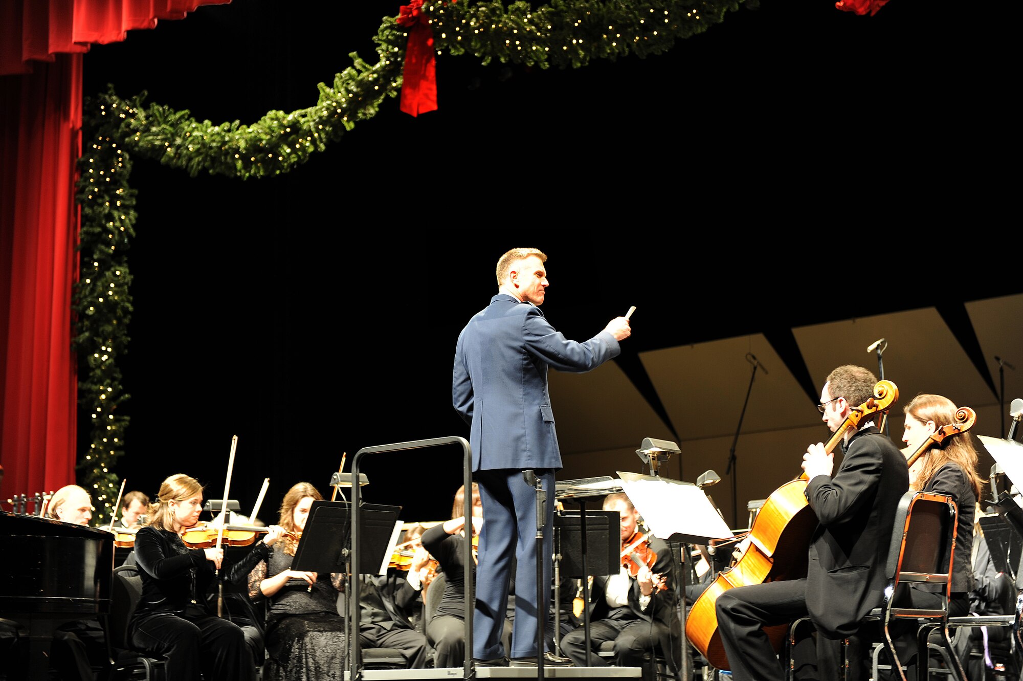ABILENE, Texas – Col. Robert Gass, 7th Bomb Wing commander, conducts “Sleigh Ride” during a free-for-military Abilene Philharmonic concert Dec. 6. According to a recent press release, the Abilene Philharmonic Orchestra is one of Abilene’s oldest performing arts organizations. Led by Music Director and Conductor David Itkin, the Philharmonic is the only professional orchestra within 80 miles of Abilene and draws audiences from more than 50 Texas cities. (U.S. Air Force photo/Senior Airman Jennifer Romig)