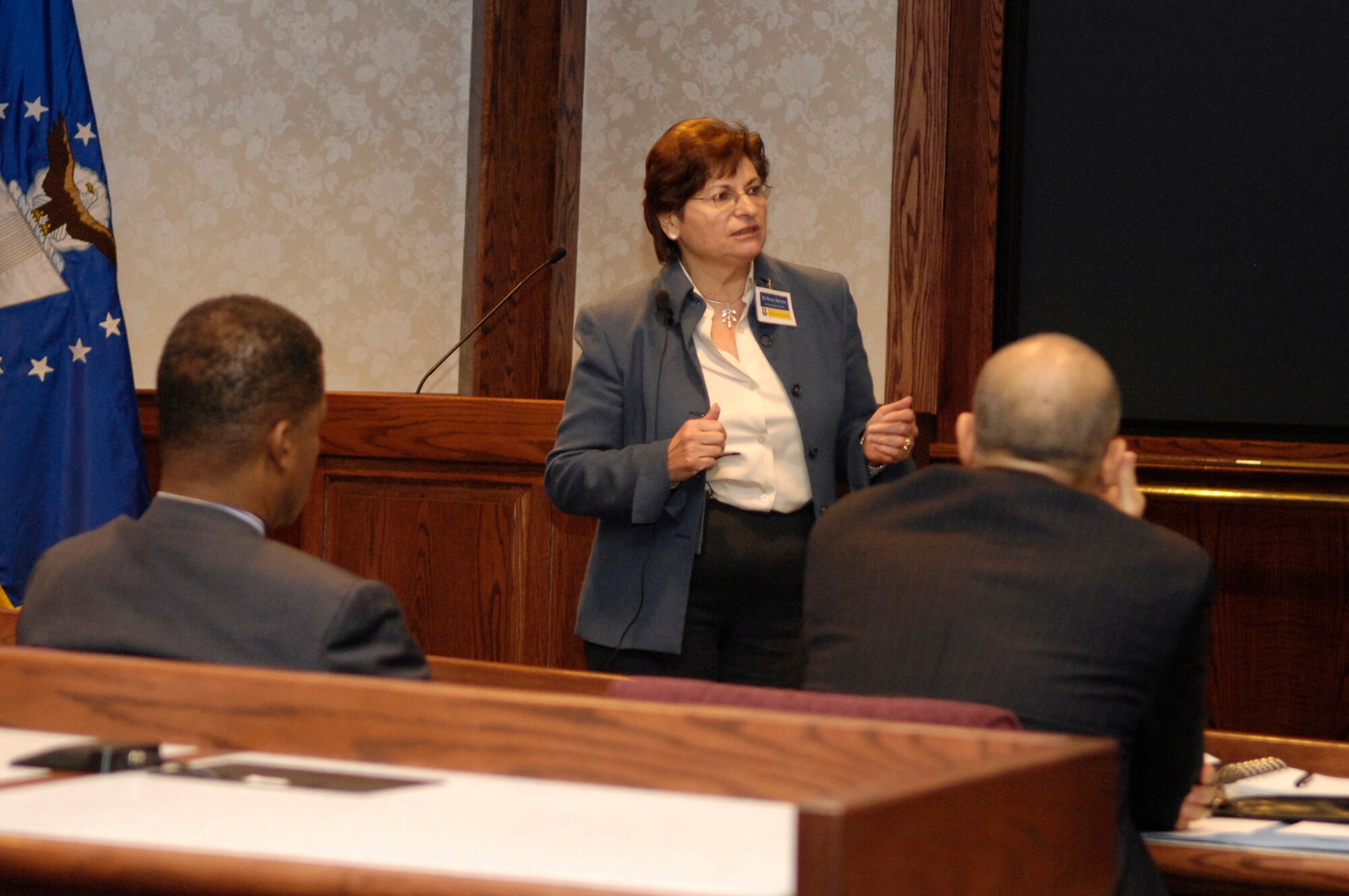 Renée Stevens of MITRE briefs attendees at the Hanscom Conference Center Dec. 2 during the Rapid Agile Acquisition Conference.  The conference, sponsored by the Engineering Directorate, the Acquisition Center of Excellence, MITRE and the Jacobs Engineering Group, highlighted  systems engineering issues related to quickly developing and delivering warfighter capability. Nearly 90 people from around the country attended.