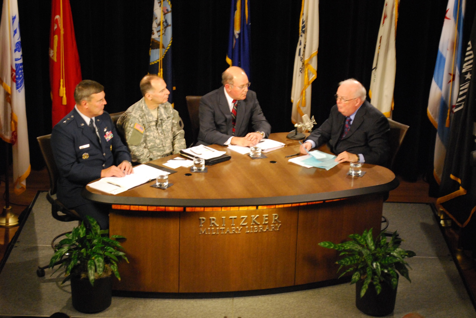 Major General Robert Duignan, Commander, 4th Air Force, participates in a panel discussion provoding and update on Reserve and Guard forces with Major General (IL) William L. Enyart, 37th Adjutant General of the State of Illinois, Dr. John D. Winkler, Principal Deputy Assistant Secretary of Defense for Reserve Affairs and moderator John Callaway.  The panel was part of "Front and Center" a world-wide webcast and locally televised military public affairs program produced by the Pritzker Military Library in Chicago. (U.S. Air Force photo/Senior Airman Zach Anderson)