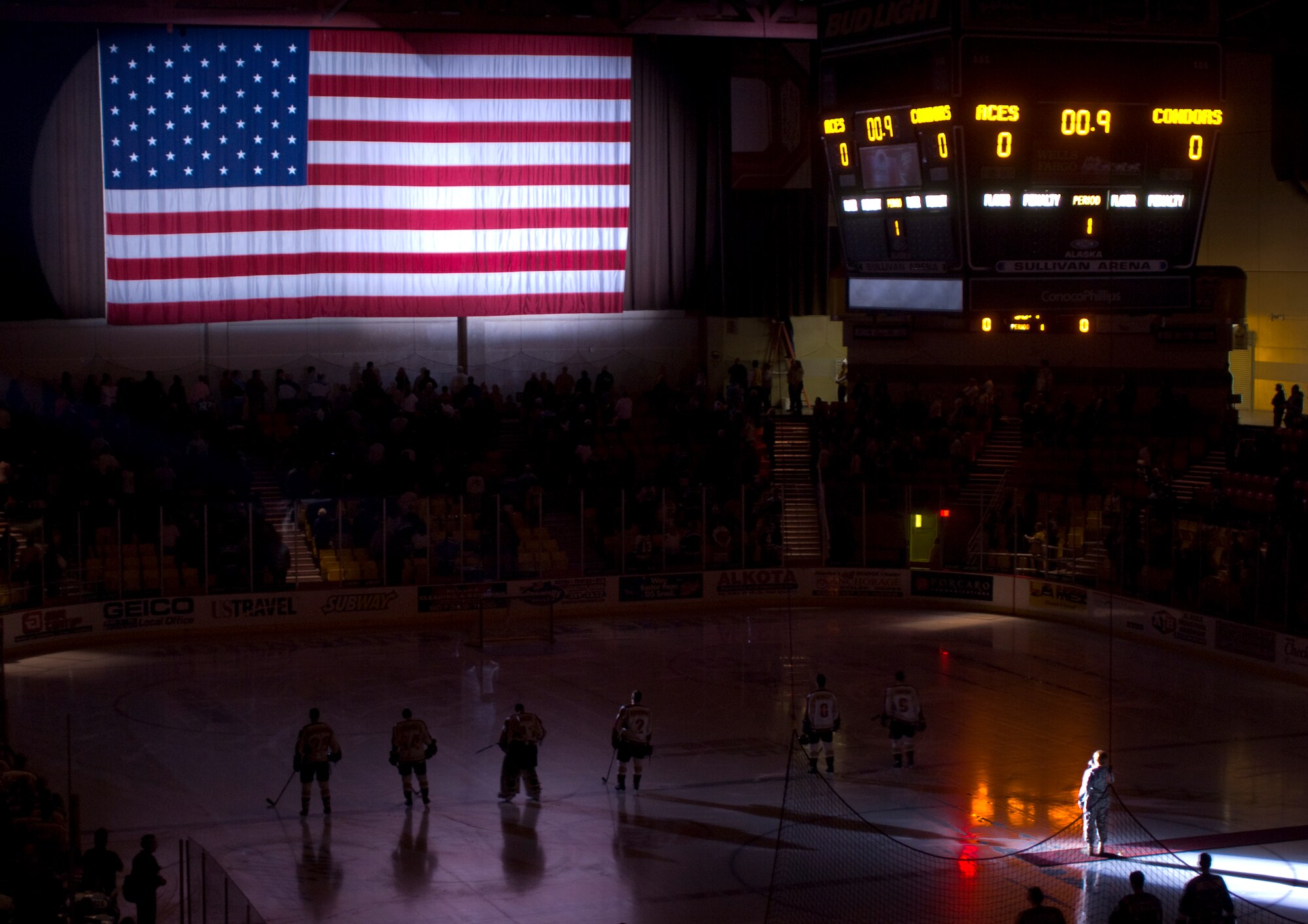ANCHORAGE, Alaska -- Army Staff Sgt. Val Lari, 9th Army Band, sing the national anthem at the Alaska Aces' military appreciation game Dec. 6. Several members of Elmendorf leadership and Gen. Carrol "Howie" Chandler, Pacific Air Forces commander, attended this year's game. The Aces beat the Bakersfield Condors 6-0. (U.S. Air Force photo/Airman 1st Class David Carbajal)