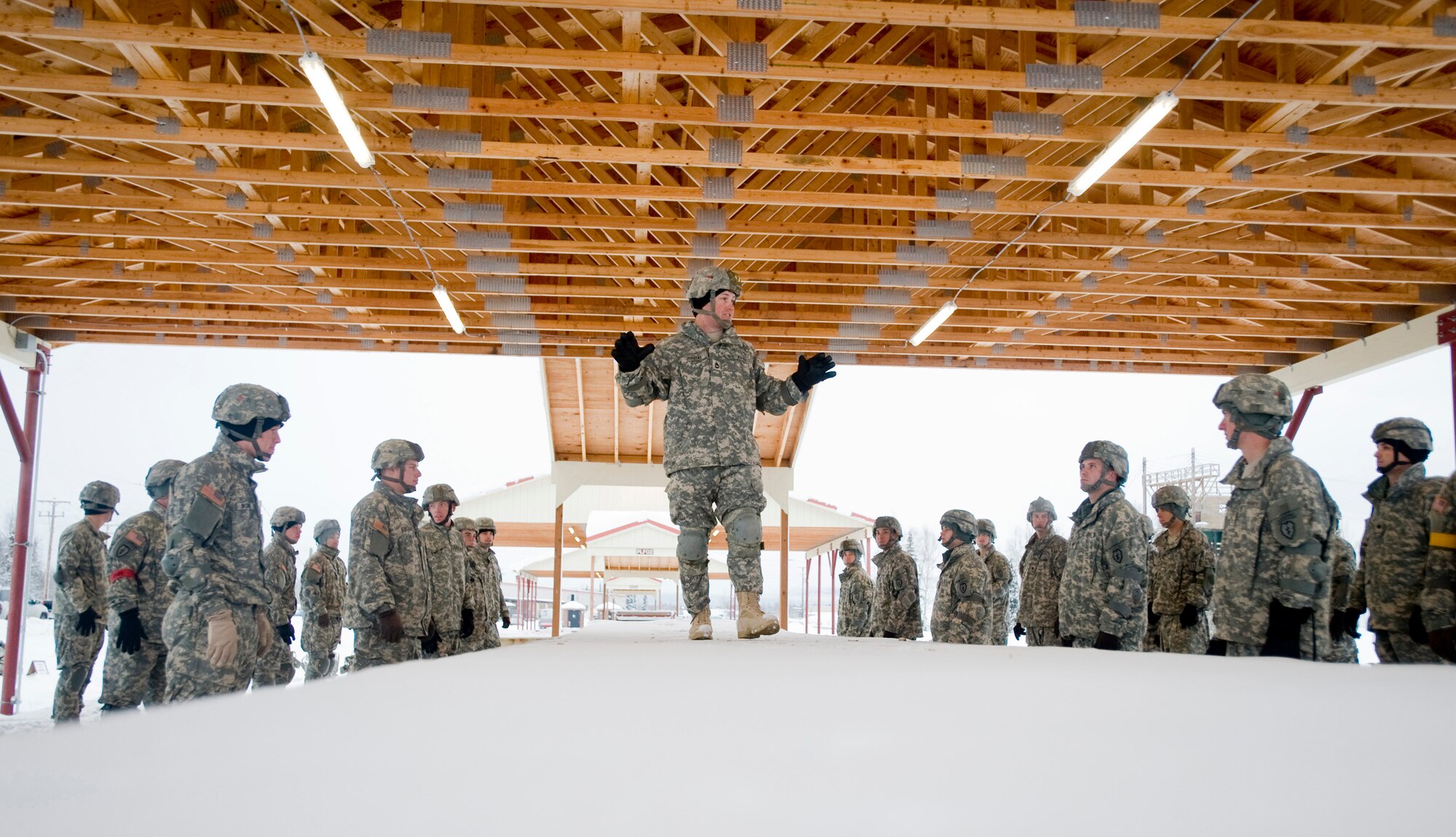 FORT RICHARDSON, Alaska -- Army Sgt. 1st Class Brian Zoleske, 4-25 Brigade Special Troops Battalion jump masters, goes over landing procedures Dec. 5. The 4-25 BSTB has to go to Sustainment Airborne Training 24 hours prior to jumping. The sustainment training will go over jumping and landing procedures. (U.S. Air Force photo/Senior Airman Jonathan Steffen)
