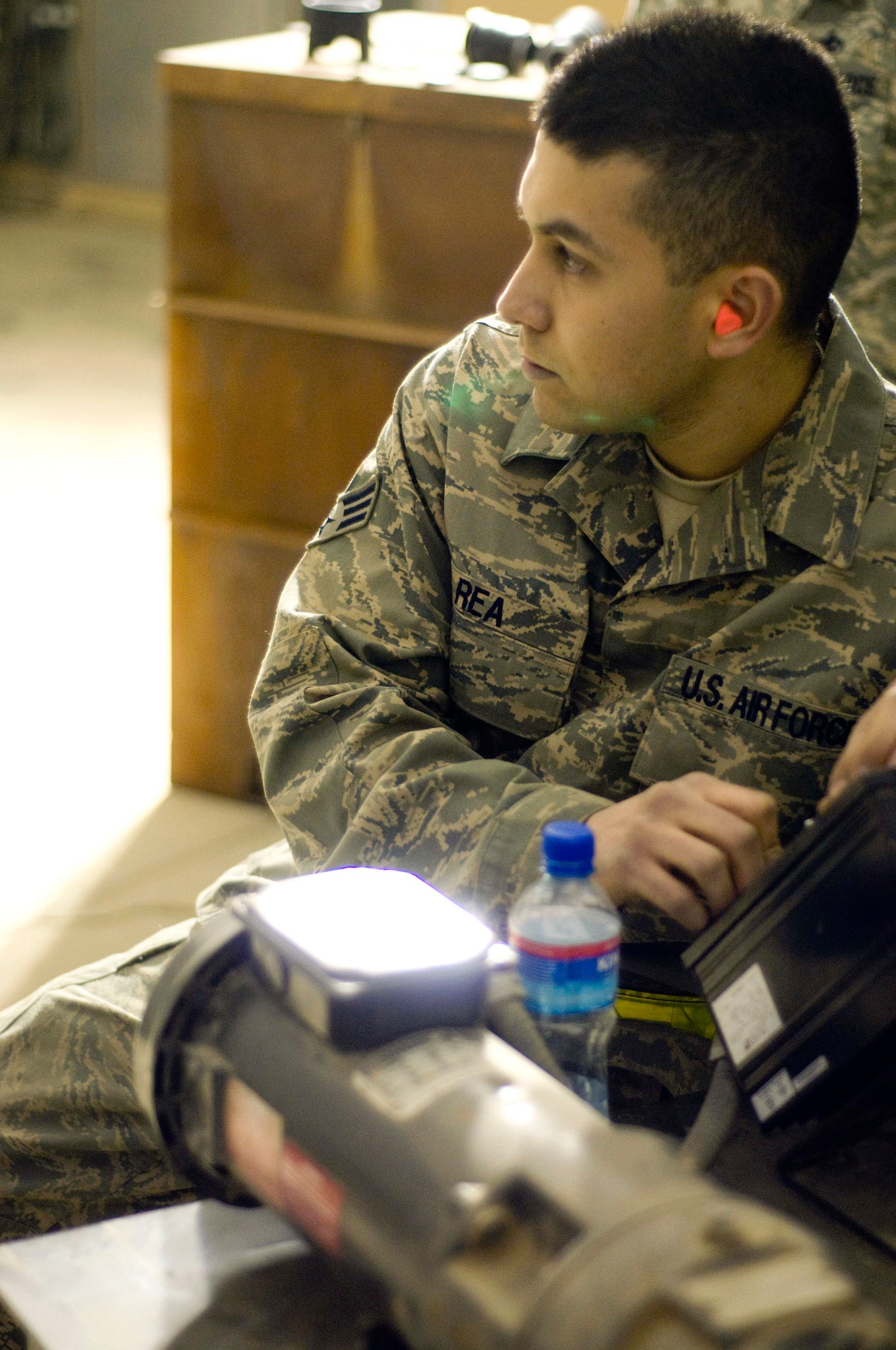 Senior Airman Juan Rea operates the controls of a GFU-7 "Dragon" Dec. 2 at Bagram Air Field, Afghanistan. Manual control of the machine allows Airman Rea stop the GFU-7 if there is a jam. Airman Rea is a 455th Expeditionary Maintenance Squadron munitions system journeyman and deployed from Mountain Home Air Force Base, Idaho. He hails from Brownsville, Texas. (U.S. Air Force photo/Staff Sgt. Samuel Morse)