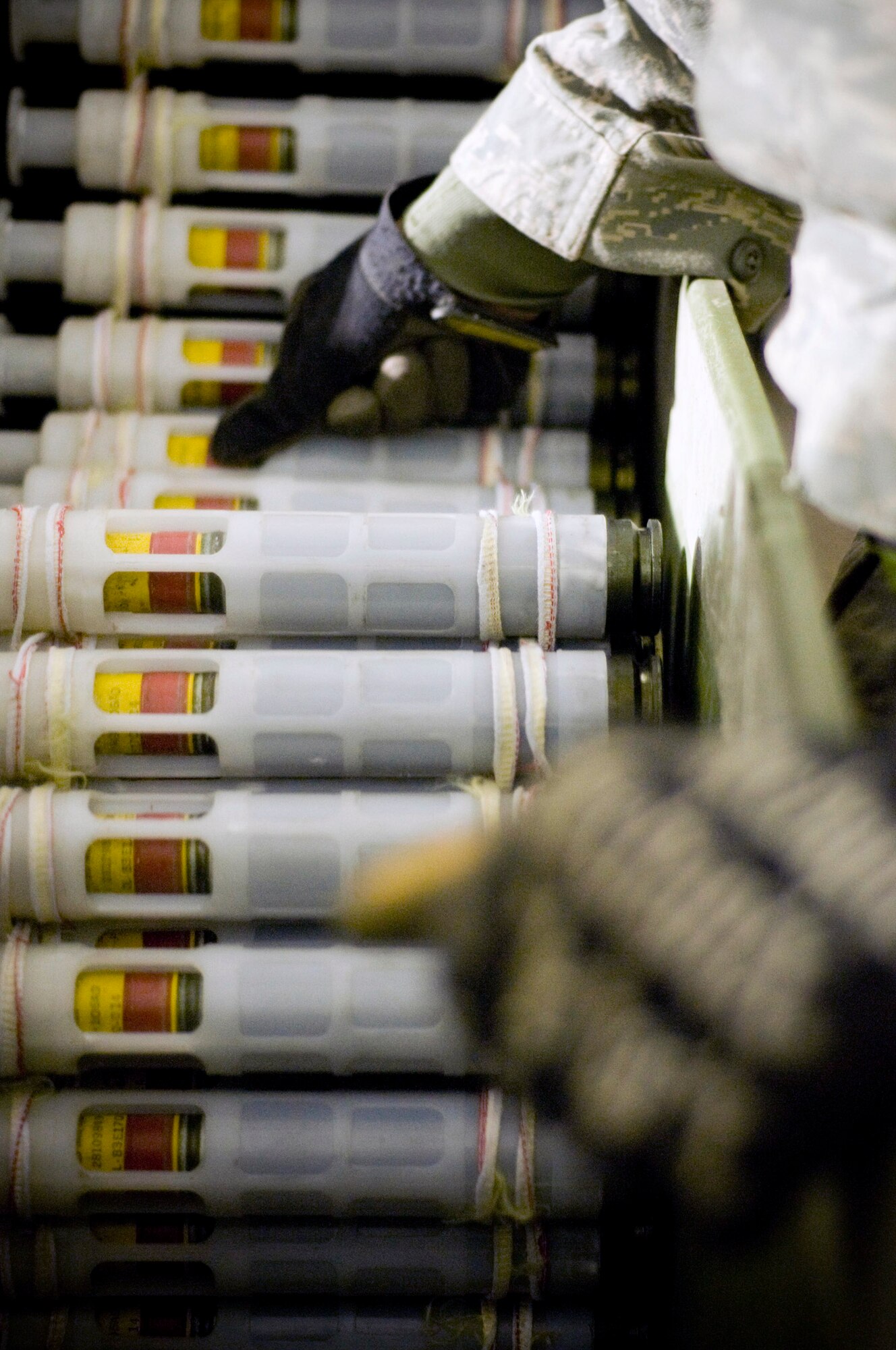 Airman 1st Class Jeb Snow guides PGU-13 high-explosive incendiary rounds into the GFU-7 "Dragon" for processing Dec. 2 at Bagram Airfield, Afghanistan. The GFU-7 allows the Airmen to check the rounds and carriers to make sure they're ready to be uploaded to the A-10 Thunderbolt II. Airman Snow is a 455th Expeditionary Maintenance Squadron munitions systems apprentice deployed from Mountain Home Air Force Base, Idaho He hails from Wasilla, Alaska. (U.S. Air Force photo/Staff Sgt. Samuel Morse) 