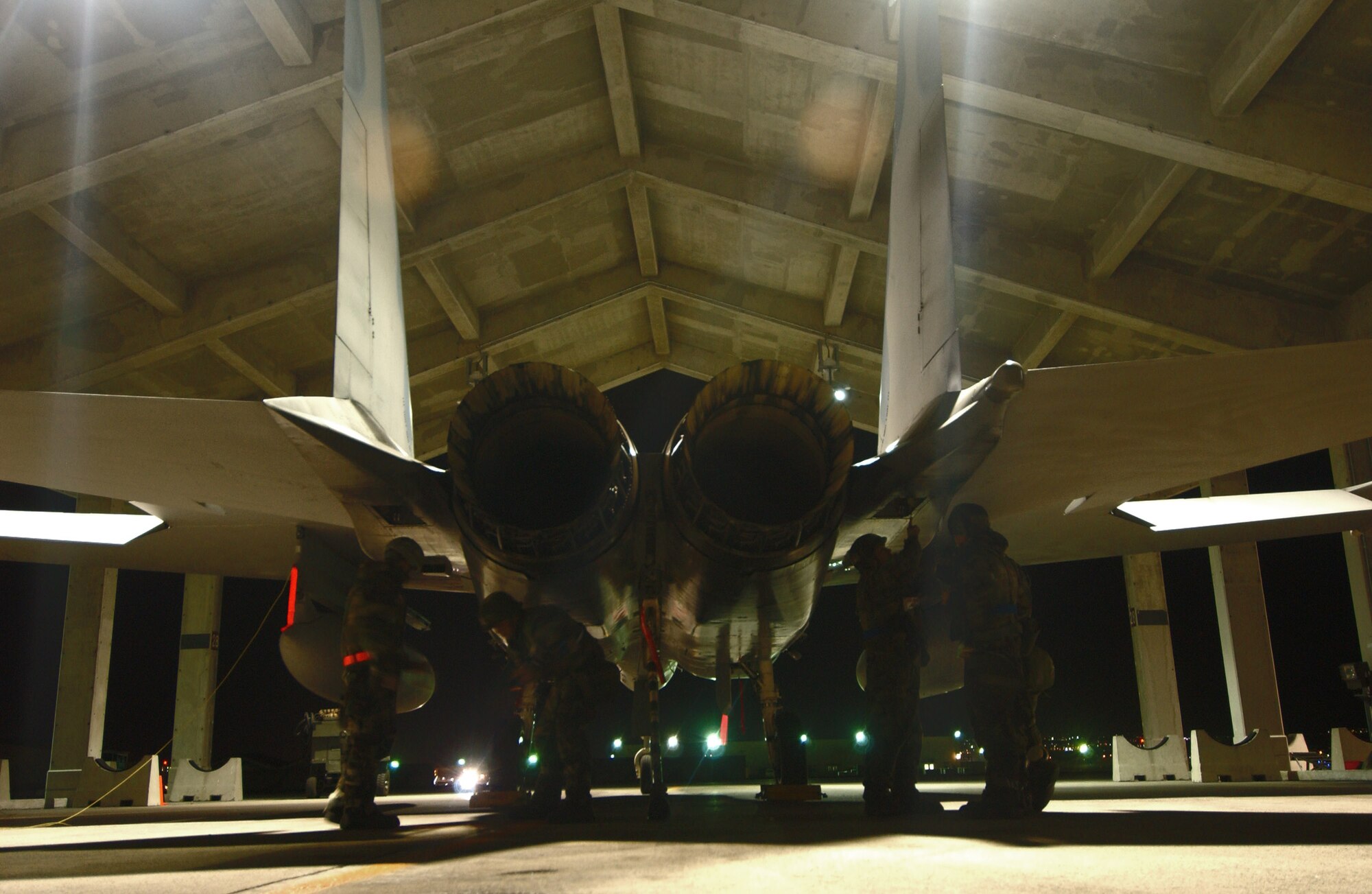 Airmen from the 44th Aircraft Maintenance Unit drop panels from an F-15 Eagle to check the stag actuators for flight control problems during Exercise Beverly High 09-01 Dec. 4 at Kadena Air Base, Japan. The exercise, which was conducted jointly with Marines from Marine Corps Station Iawkuni, tested the ability of both services to execute their critical missions under simulated combat conditions. (U.S. Air Force photo/Tech. Sgt. Rey Ramon) 
