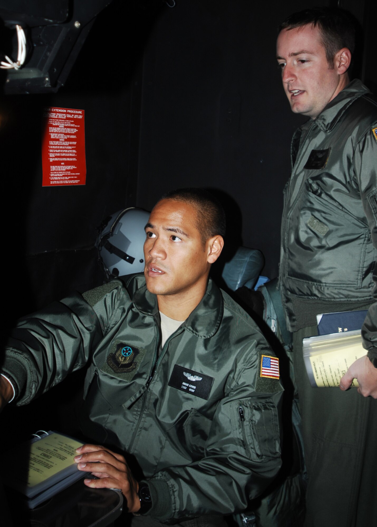 CANNON AIR FORCE BASE, N.M. -- Staff Sgts. Brian Cover and Brad Atwater, 19th Special Operations Squadron, Hurlburt Field, Fla., perform a pre-flight inspection on a low-light television system onboard an AC-130H aircraft Nov.6. Air Force Special Operations Training Center officially stood up Oct. 6 at Hurlburt Field, Fla. and Detachment 1 AFSOTC turns Airmen into Air Commandos here so operational flying units can focus directly on the Global War On Terror. 
(Air Force photo by Greg Allen) 