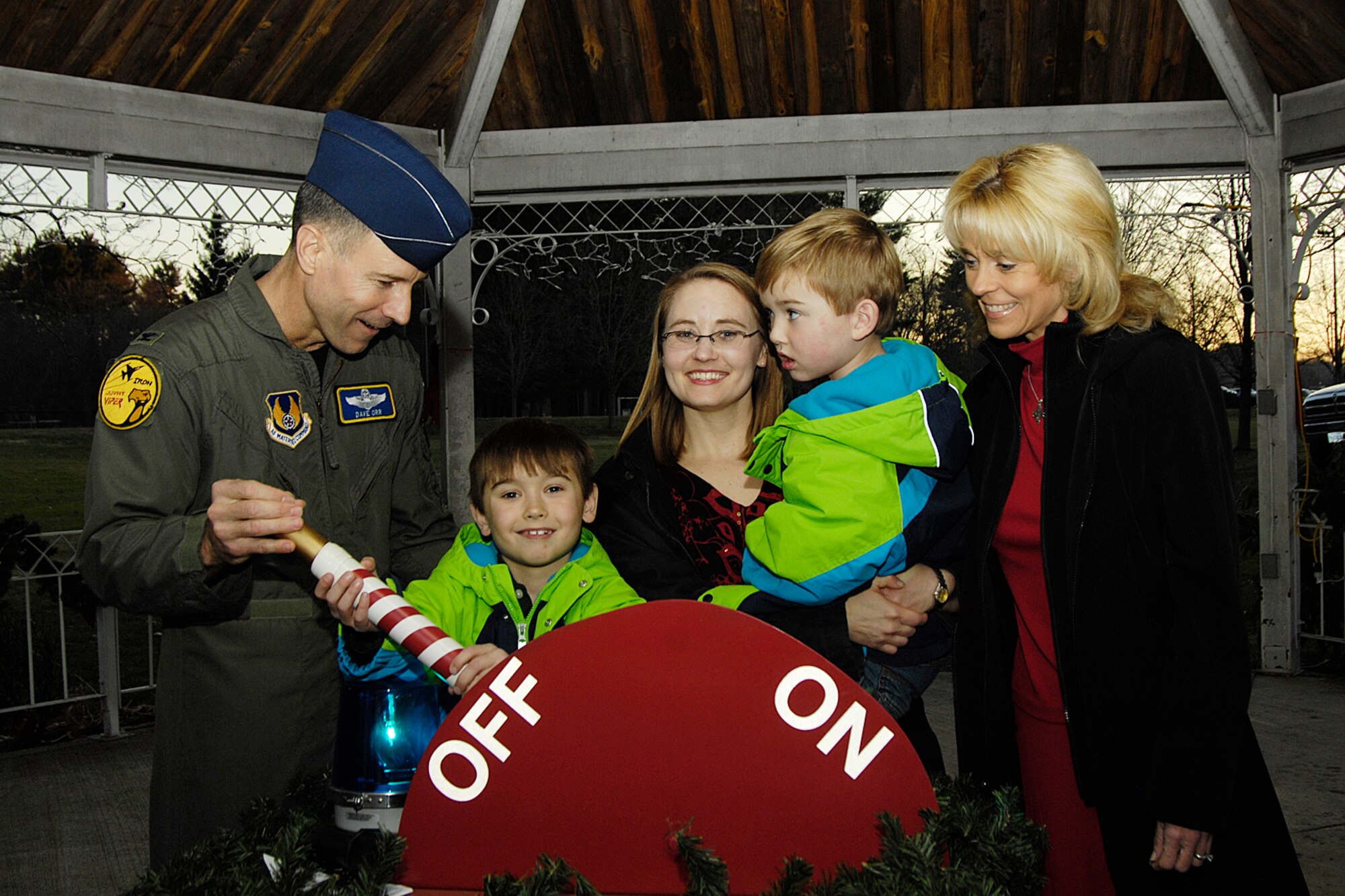 HANSCOM AIR FORCE BASE, Mass. – Col. David Orr (left), 66th Air Base Wing commander, and his wife Lisa (right) illuminate the holiday tree with some help from(second from left to right) Cameron, Jodi, and Ryan Long. The tree lighting ceremony took place at the Base Chapel on Dec. 3. (U.S. Air Force photo by Linda LaBonte Britt)