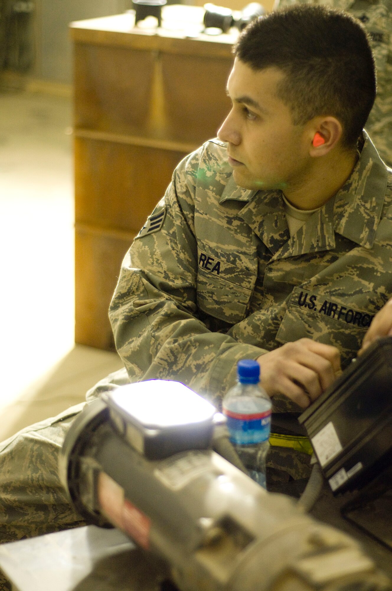 Senior Airman Juan Rea, 455th Expeditionary Maintenance Squadron munitions system journeyman, operates the controls of a GFU-7 "Dragon" at Bagram Air Field, Afghanistan, Dec. 2. Manual control of the machine allows his teammates to have Airman Rea stop the GFU-7 if there is a miss-feed or jam. He is deployed from the 366th Equipment Maintenance Squadron, Mountain Home Air Force Base, Idaho, and hails from Brownsville, Texas. (U.S. Air Force photo by Staff Sgt. Samuel Morse)(Released)