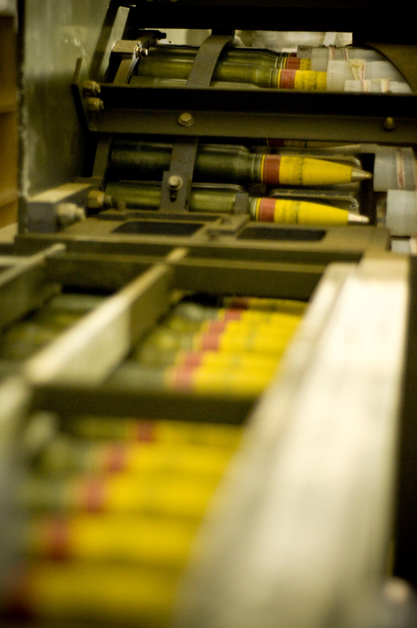 30mm high-explosive incendiary rounds feed through a GFU-7 "Dragon" during processing at Bagram Air Field, Afghanistan, Dec. 2. The Ammo Flight at Bagram Air Field, part of the 455th Expeditionary Maintenance Squadron, uses the GFU-7 to inspect these rounds which form the backbone of the A-10 Thunderbolt II's armament and ready them for seamless loading into the aircraft. (U.S. Air Force photo by Staff Sgt. Samuel Morse)(Released)