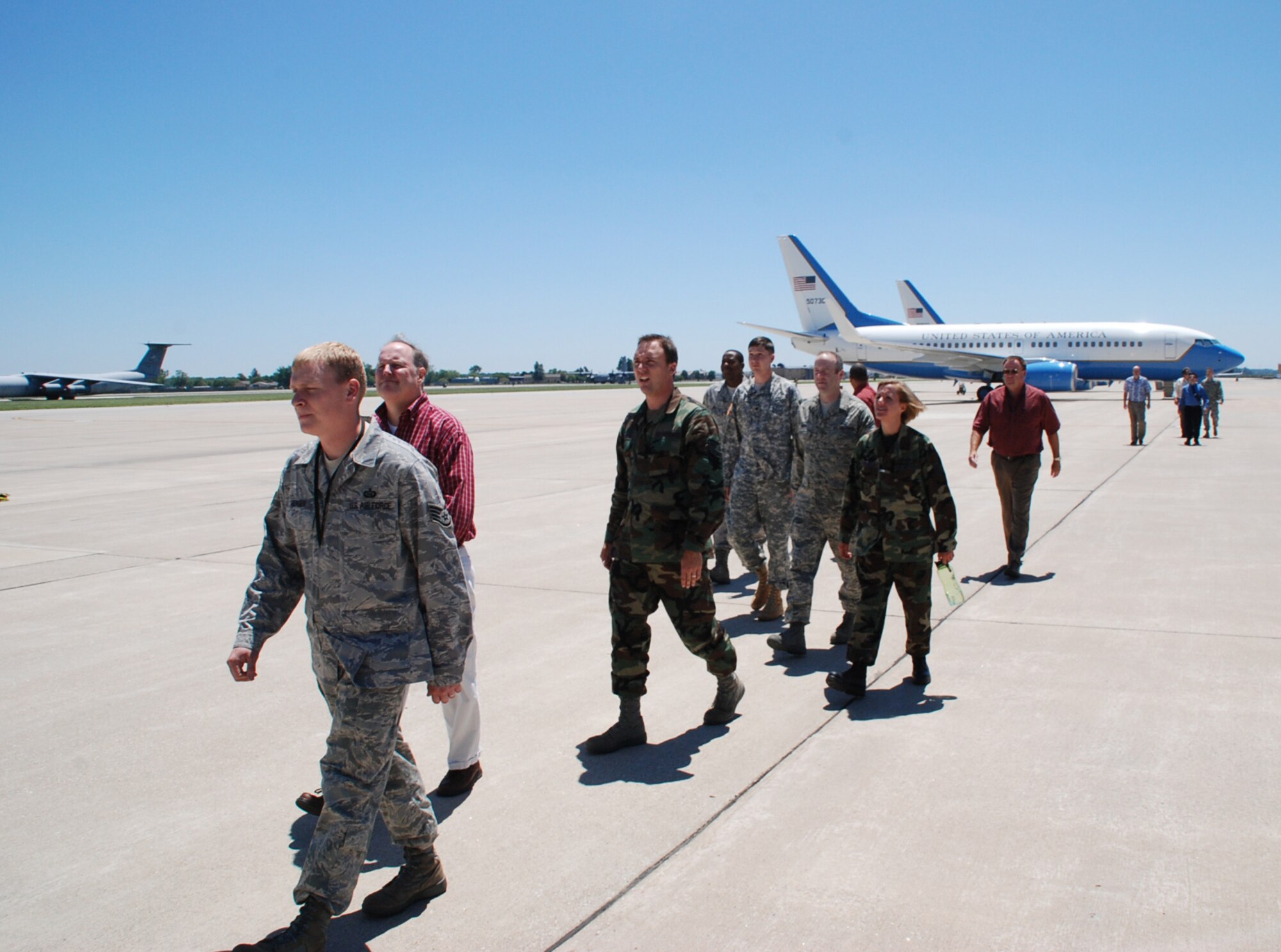 932nd Airlift Wing operations members showed off their mission to other Scott Air Force Base personnel during a quick visit.  In the background at right are two of the three C-40C planes belonging to the Air Force Reserve Command wing.  (U.S. Air Force photo/Maj. Stan Paregien)