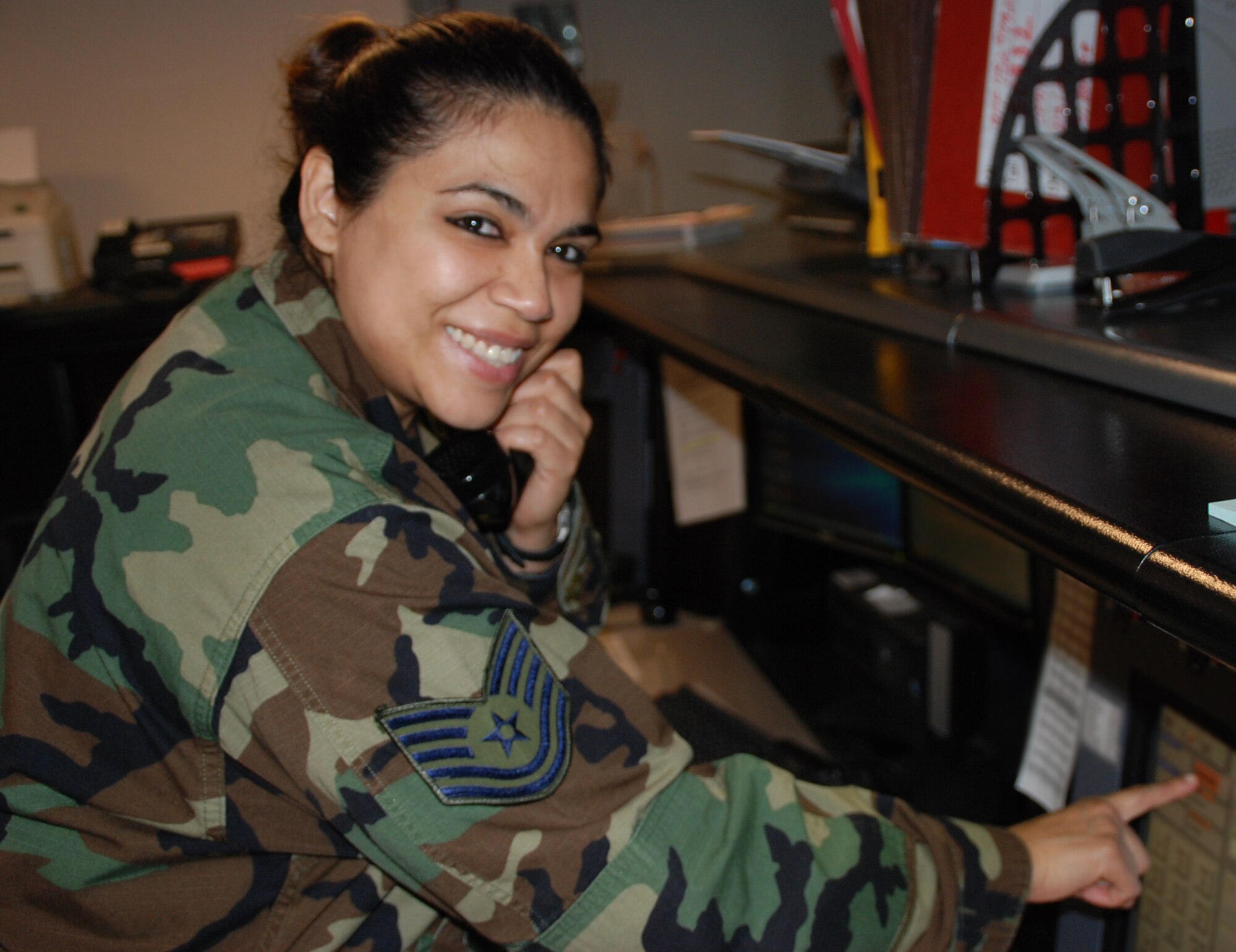 Question of the Month from the Gateway wing paper:  "What makes the command post a great place to work?"  Tech. Sgt. Jannet Catalan said, "We are the executive ambassadors for the wing commander. We are his eyes and ears when he is not around."  She is a member of the 932nd Airlift Wing at Scott Air Force Base, Ill.  (U.S. Air Force photo/Tech. Sgt. Dan Oliver)