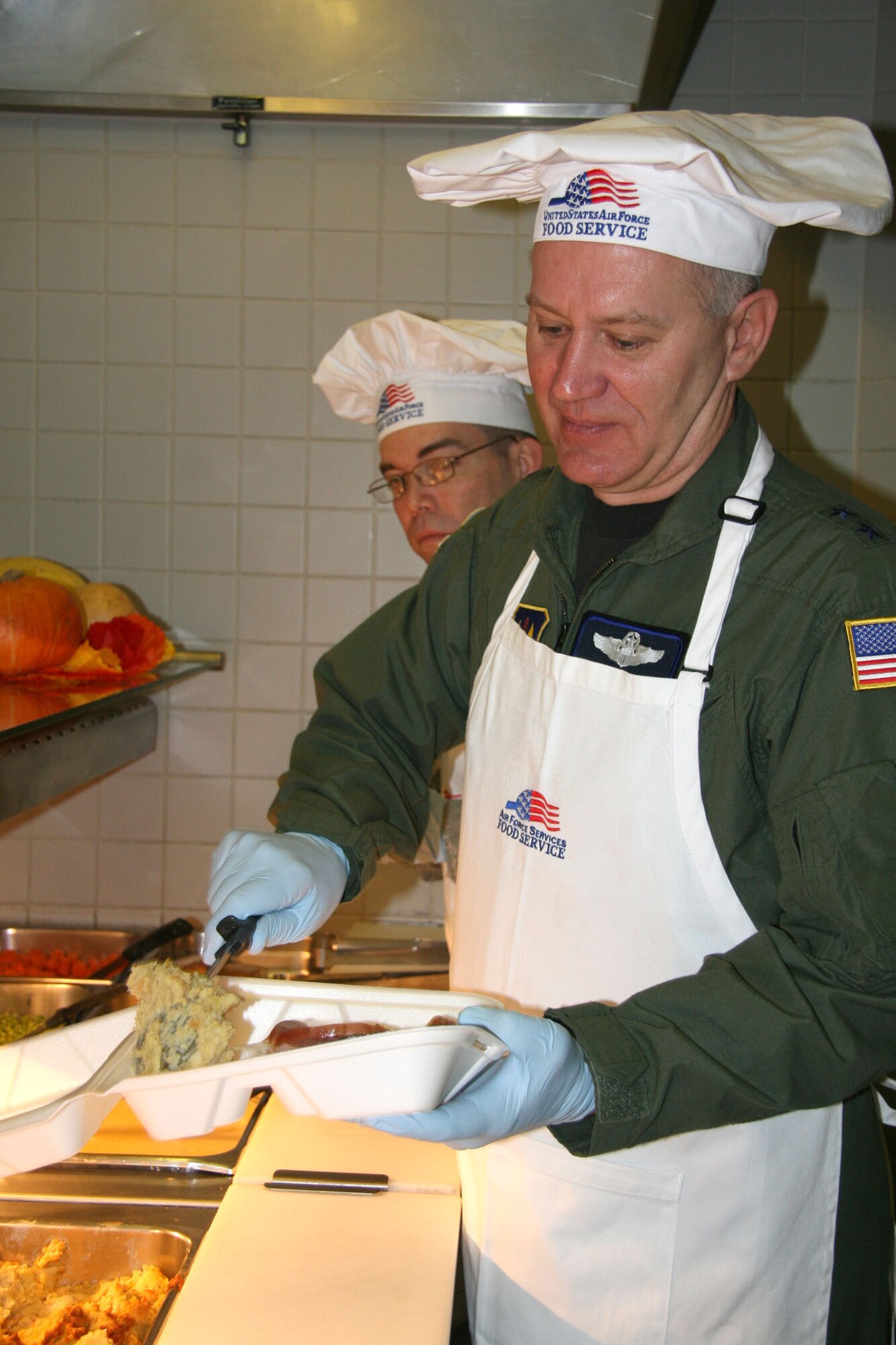 Maj. Gen. Ron Ladnier, commander of Seventeenth Air Force, serves up turkey and all the fixin's at the Ramstein Air Base, Germany, dining facility on Thanksgving day. The general joined with other Ramstein senior leaders in serving the troops, a holiday tradition for Air Force commanders. 
Seventeenth Air Force, which recently activated at Ramstein, is the air component for U.S. Africa Command. (Air Force photo by Ms. Julie Rich) 