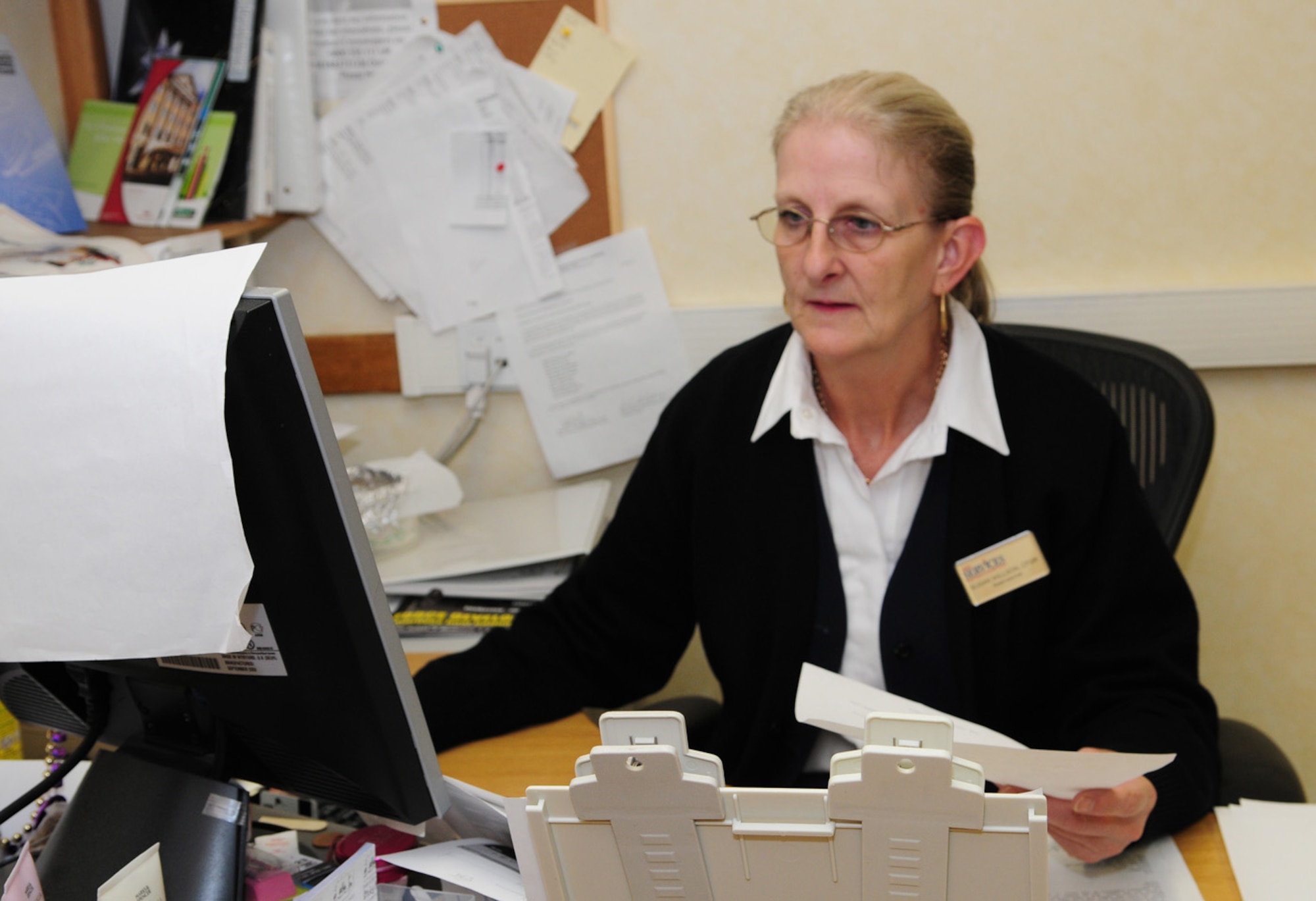 Susan Willson, 100th Force Support Squadron Gateway Inn reservations, makes group booking reservations Nov. 21. The Gateway Inn has two temporary lodging facilities and offers 318 rooms in eight buildings. One of the TLFs was renovated in 2006 and has 18 suites and eight pet-friendly units. The other opened in 2005 and has 30 two-bedroom units and 10 one-bedroom units. For each of the pet-friendly units, a kennel, and food and water bowls are provided. A maximum of two pets is allowed, which can only be cats or dogs. It is recommended that reservations are made as early as possible for rooms as they get booked quickly. (U.S. Air Force photo by Karen Abeyasekere)