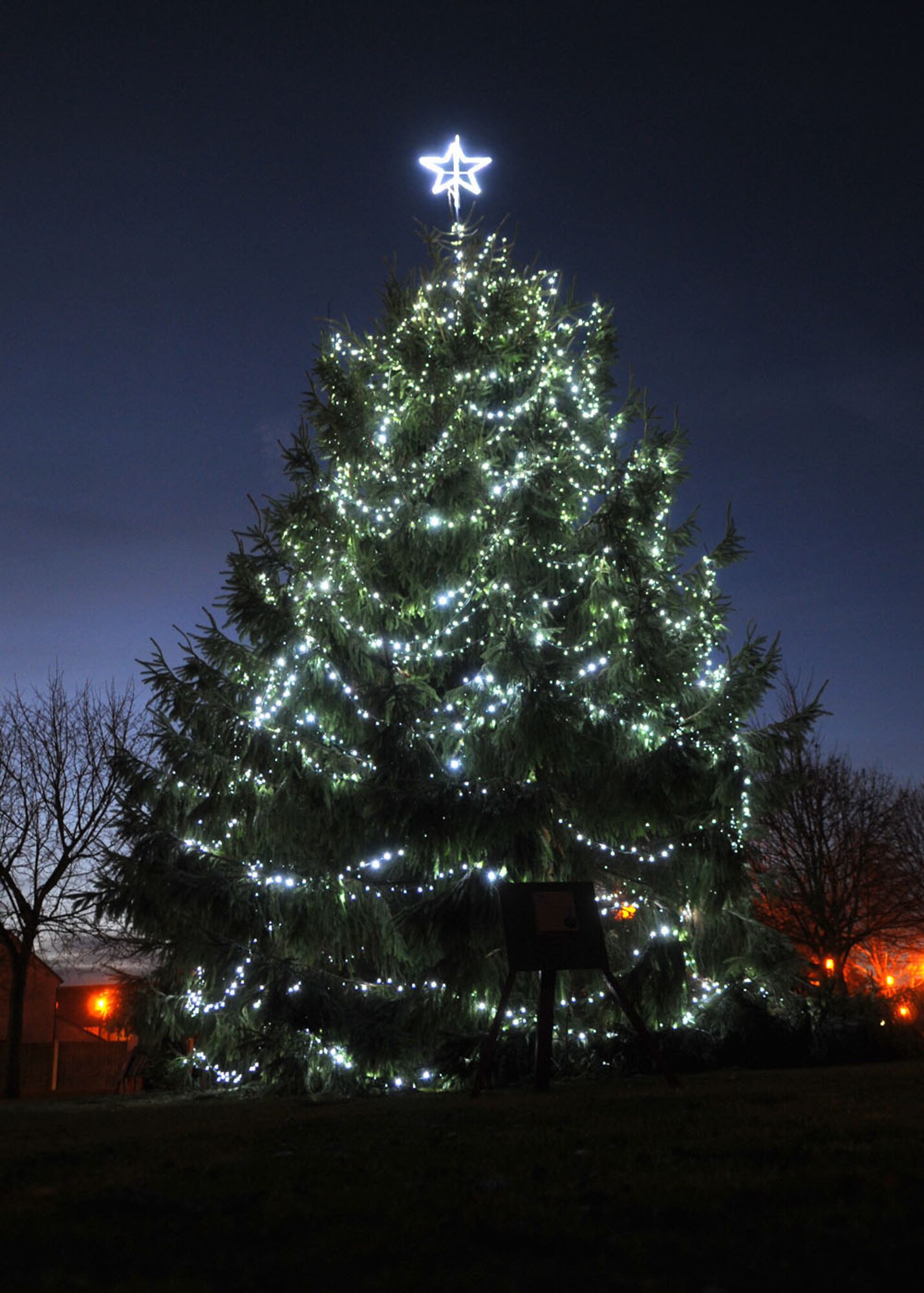 Team Mildenhall's Christmas tree stands tall and bright after the tree lighting ceremony Dec. 4, 2008, in RAF Mildenhall, England. This year's event will take place adjacent to the Bob Hope Community Center (U.S. Air Force photo by Staff Sgt. Jerry Fleshman) 