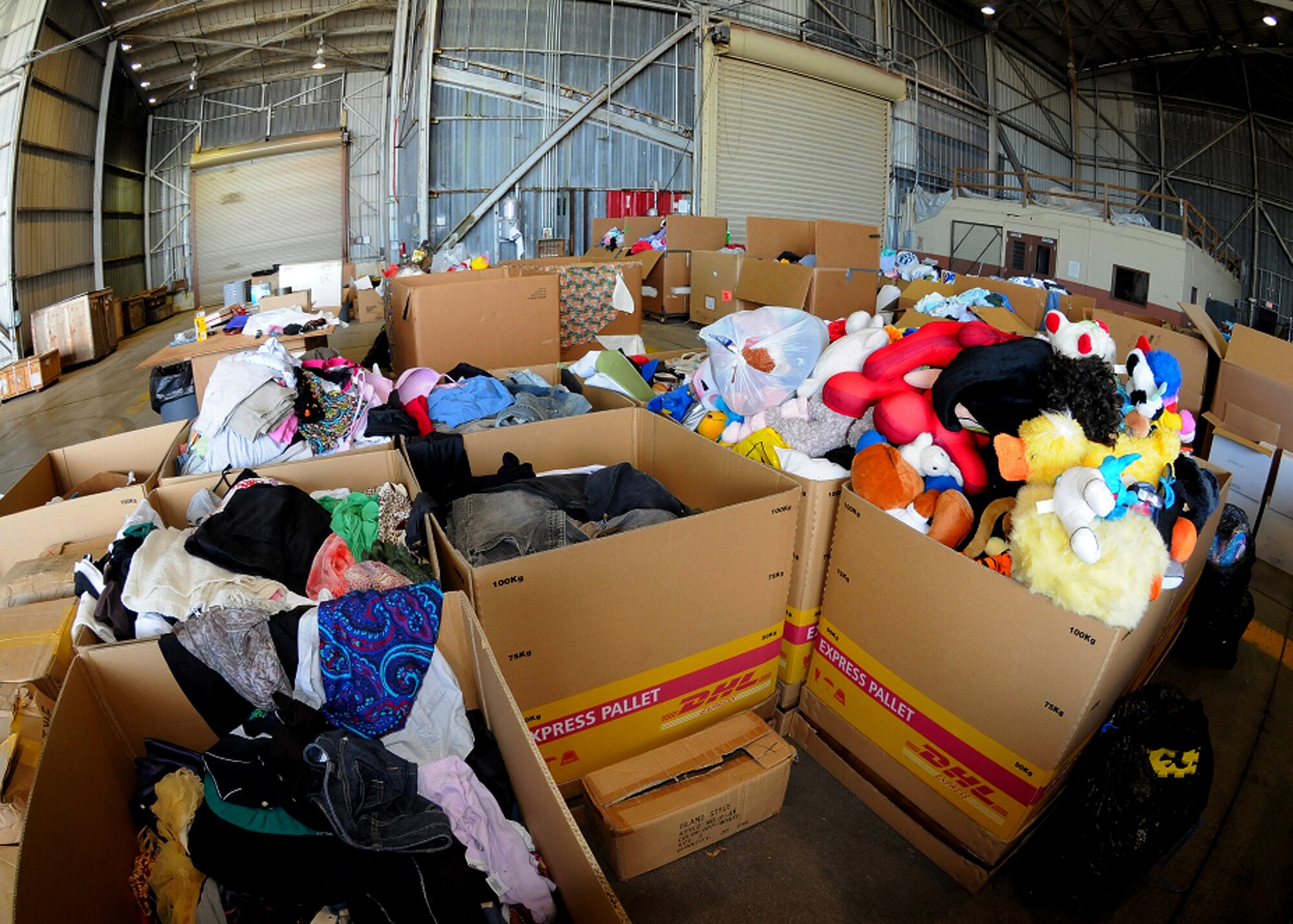 ANDERSEN AIR FORCE BASE, Guam - More than 186 boxes are filled with toys, first aid kits, food and supplies here Dec. 7 at Hangar 4 during the Operation Christmas Drop final box build. Christmas Drop is the longest running humanitarian campaign in the world and this year marks it 56th year in operation.(U.S. Air Force photo by Senior Airman Nichelle Griffiths)