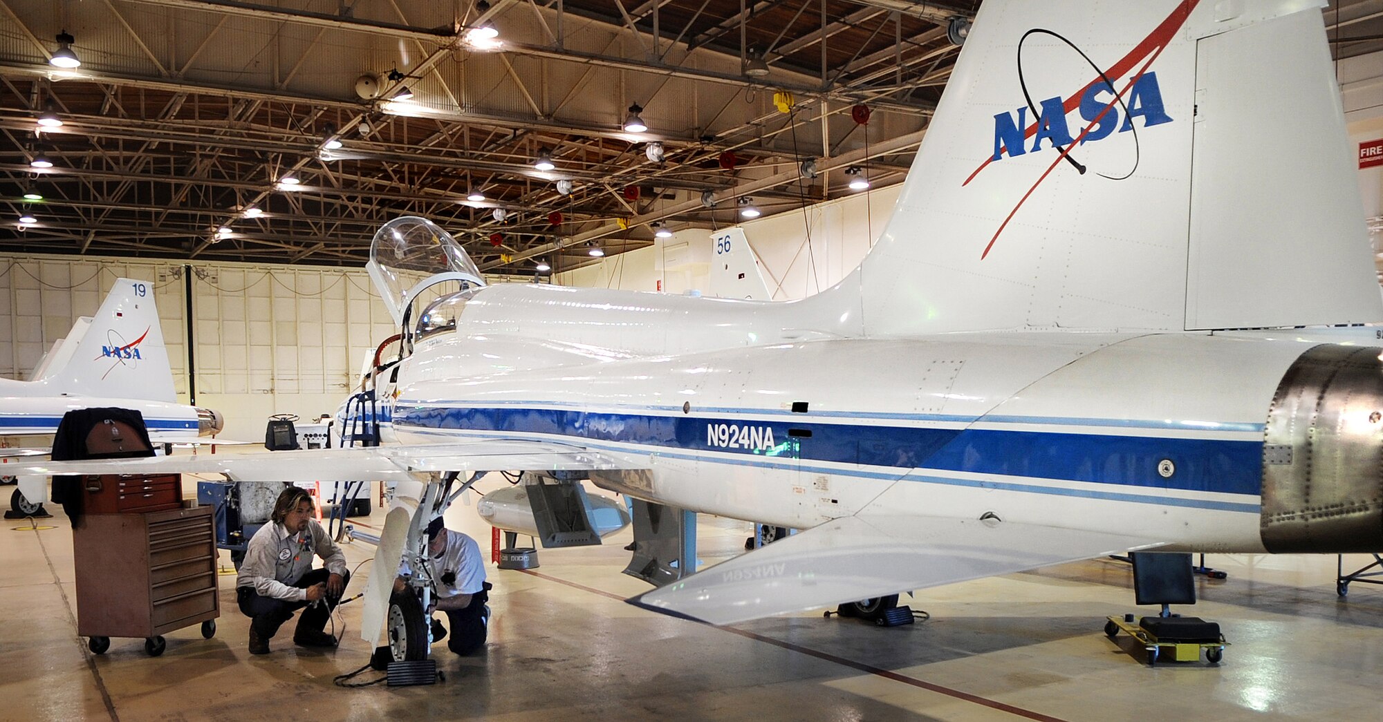 Jesse Perez and Mike Parrott perform a routine brake check on a NASA T-38 Dec. 2 in Ellington Field, Texas. Mr. Perez is an avionics technician and Mr. Parrott is an unscheduled maintenance crew leader for NASA. (U.S. Air Force photo/Staff Sgt. Desiree N. Palacios) 
