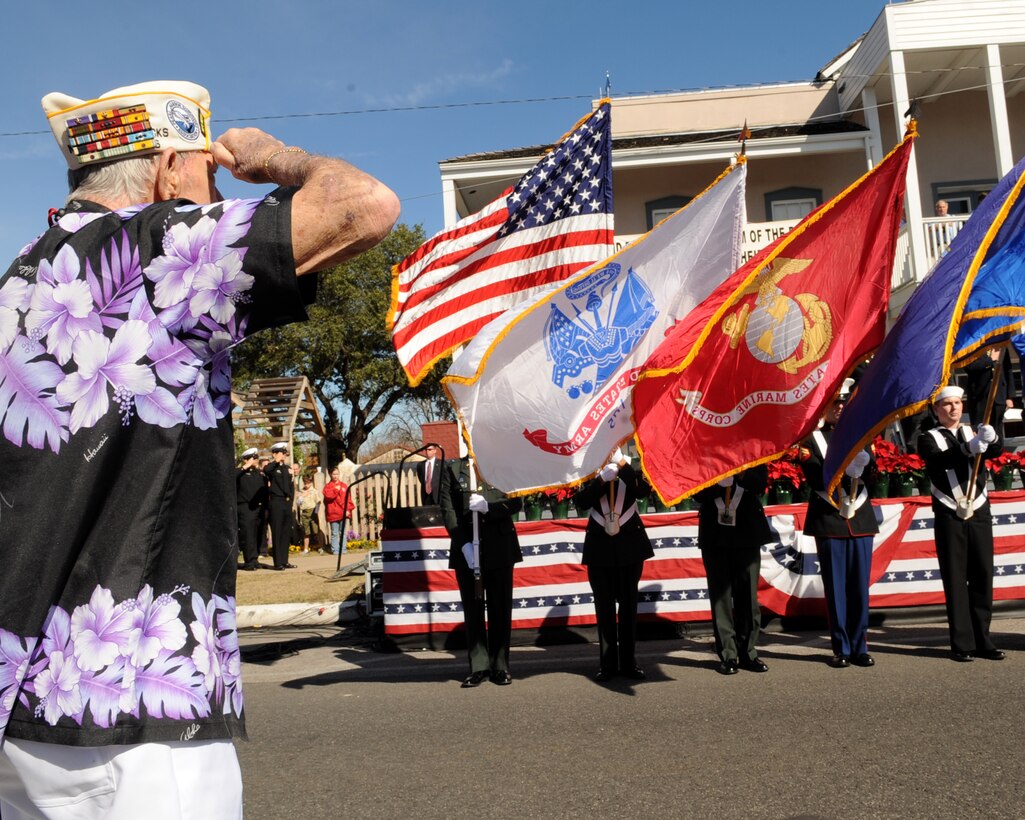 World War II veteran and two-time Purple Heart recipient James Evans salutes the flags at the Pearl Harbor Survivors Memorial Service in Fredericksburg, Texas, Dec. 7, 2008.