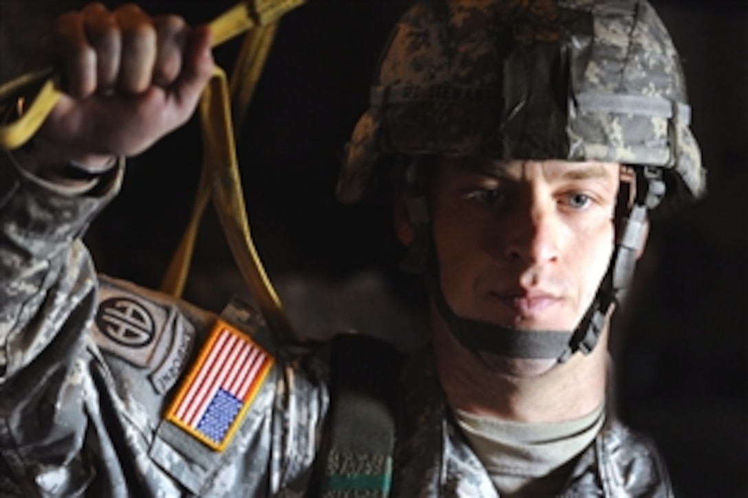 A U.S. Army soldier prepares to parachute from a C-130 Hercules aircraft during Operation Toy Drop on Fort Bragg, N.C., Dec. 6, 2008. The soldiers are assigned to the 82nd Airborne Division. 
Operation Toy Drop is an annual airborne jump on Fort Bragg, N.C, hosted by the U.S. Army Civil Affairs and Psychological Operations Command, Airborne, and supported by Fort Braggs XVIII Airborne Corps and Pope Air Force Base's 43rd Airlift Wing.