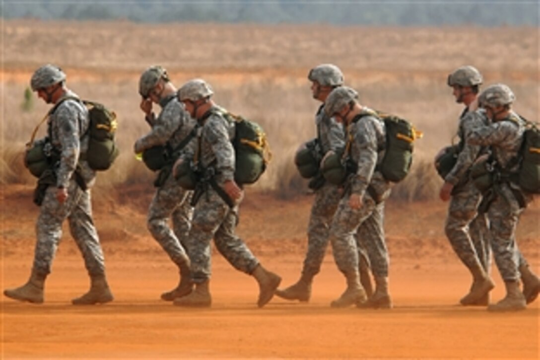U.S. Army soldiers prepare to board a C-130 Hercules aircraft during Operation Toy Drop on Fort Bragg, N.C., Dec. 6, 2008. The soldiers are assigned to the 82nd Airborne Division. Operation Toy Drop is an annual airborne jump on Fort Bragg, N.C, hosted by the U.S. Army Civil Affairs and Psychological Operations Command, Airborne, and supported by Fort Bragg's XVIII Airborne Corps and Pope Air Force Base's 43rd Airlift Wing.