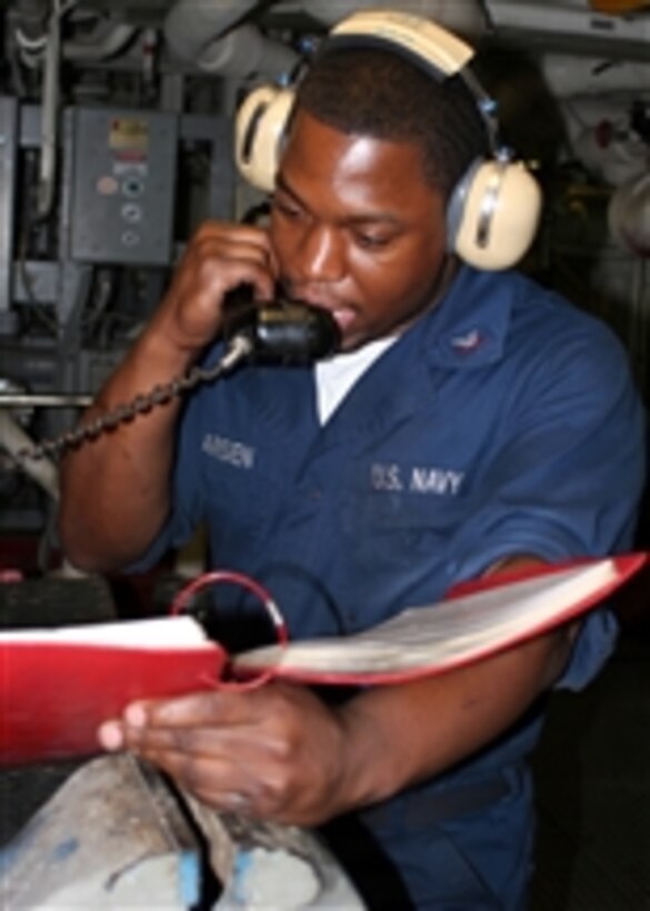 U.S. Navy Petty Officer 3rd Class Paris Pharisien gives a status report during a roving watch aboard the amphibious transport dock ship USS San Antonio (LPD 17) underway in the Persian Gulf on Dec. 2, 2008.  The San Antonio is deployed with the Iwo Jima Expeditionary Strike Group to support maritime security operations in the U.S. 5th Fleet area of responsibility.  