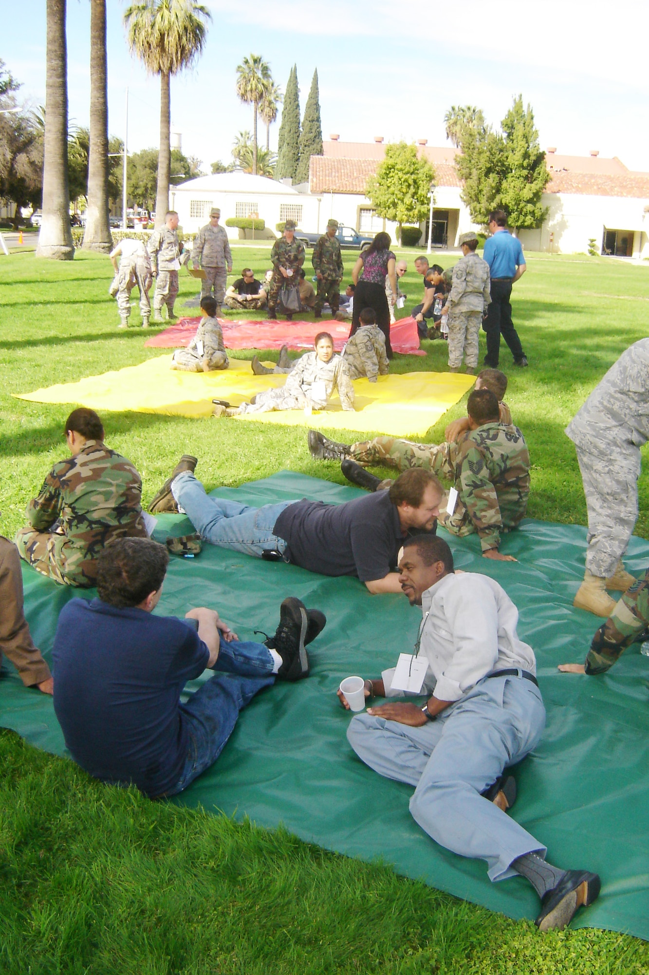 Injured personnel wait in the triage area where they sat on colored blankets that represented the nature of their wounds; from walking wounded to nearly dead. (U.S. Air Force photo by Will Alexander)