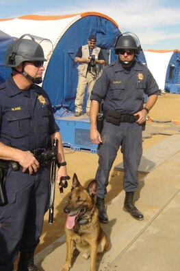 A K-9 Unit from the California Highway Patrol provides security just outside the doorway of the 200-bed Mobile Field Hospital. (U.S. Air Force photo by Will Alexander)
