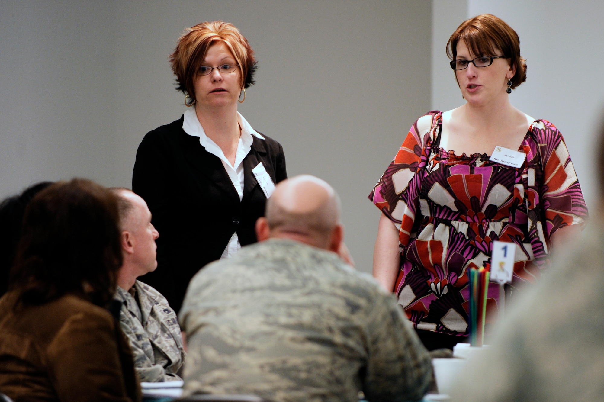 Cheri Weber, left, and Diana June, right, discuss about the current programs in the Army to help families in times of crises during a  leadership symposium to create a new program, Care Teams Tings of Compassion for Air Force families Dec. 5, 2008, at Eielson Air Force Base, Alaska. The program will be designed to setup volunteer staff to assist Air Force families who lost a loved one.  (U.S. Air Force photo/Senior Airman Jonathan Snyder)