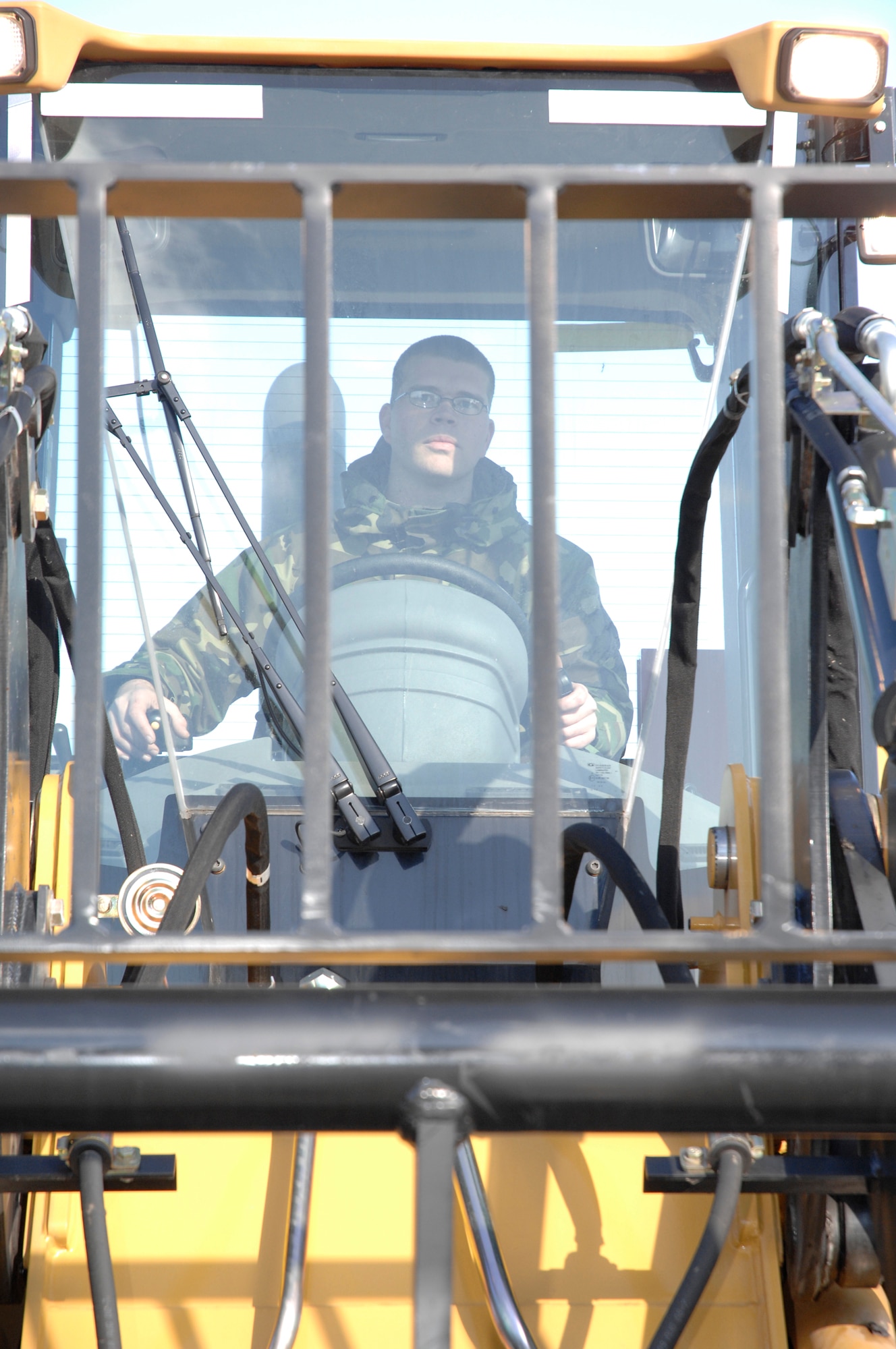 Staff Sgt. Michael Bigelow, a munitions inspector with the 88th Operations Support Squadron, drives a 10K all-terrain forklift Dec. 5 inside the Weapons Storage Area at Wright-Patterson Air Force Base. Base Airmen participated in a crisis response deployment exercise which simulated the deployment of more than 200 personnel and nearly 60 tons of cargo to an air base in Asia.  The exercise is part of base preparations for the 2009 Operational Readiness Inspection.  (U.S. Air Force photo/William Pugh) 