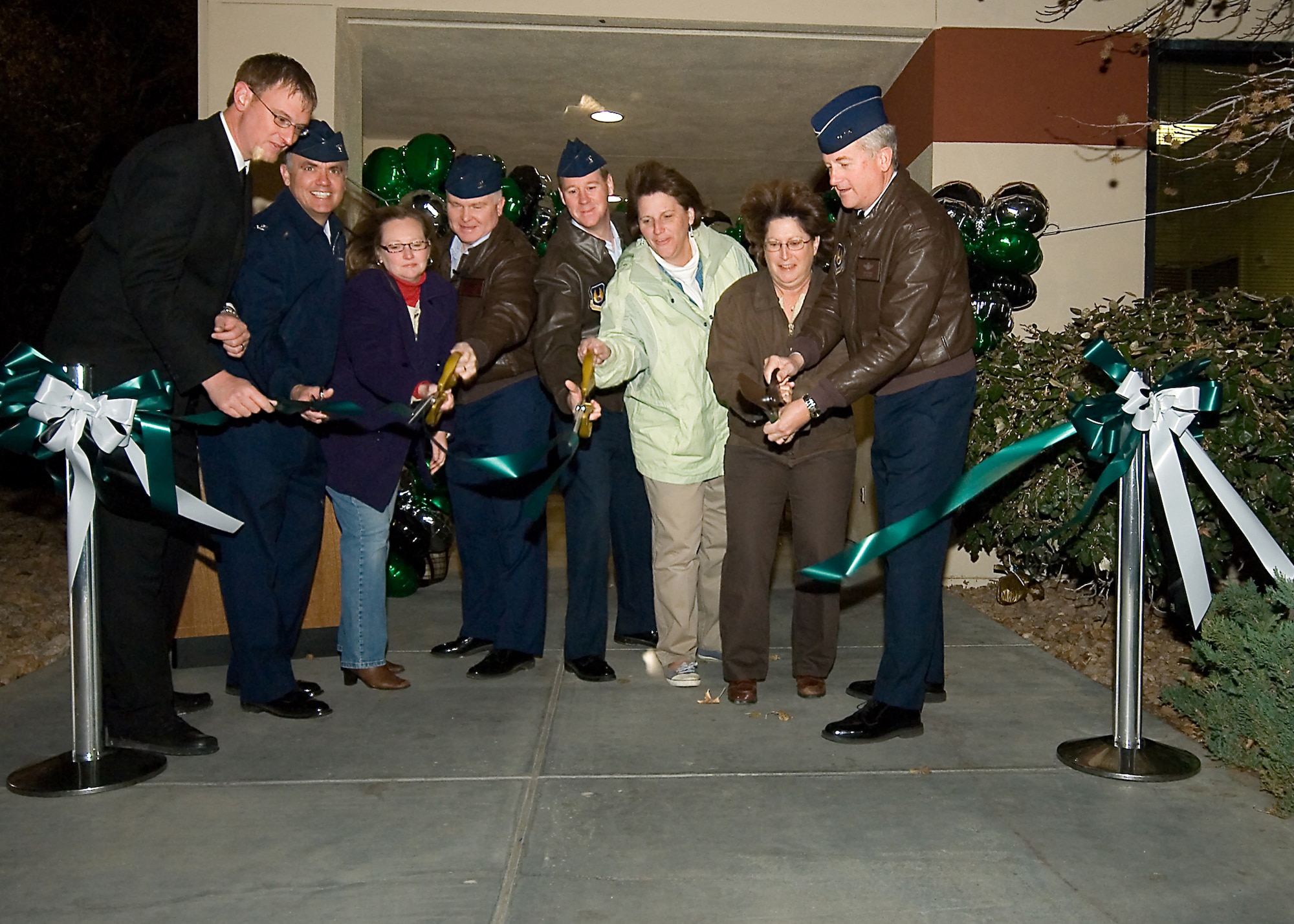 Edwards leadership and Army Air Force Exchange Service leadership cut the ribbon to mark Starbucks' grand opening Dec. 8. The new café is located in the parking lot of the Commissary and Base Exchange. (Air Force photo by Mike Yncera)
