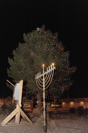 A Christmas tree and a Hanukkah menorah lighting ceremony took place on Nellis Air Force Base, Nev., December 5, 2008. The lighting ceremony is an annual tradition for Nellis and Creech Airmen to welcome the winter holiday season. (U.S. Air Force Photo / Airman 1st Class Stephanie Rubi)