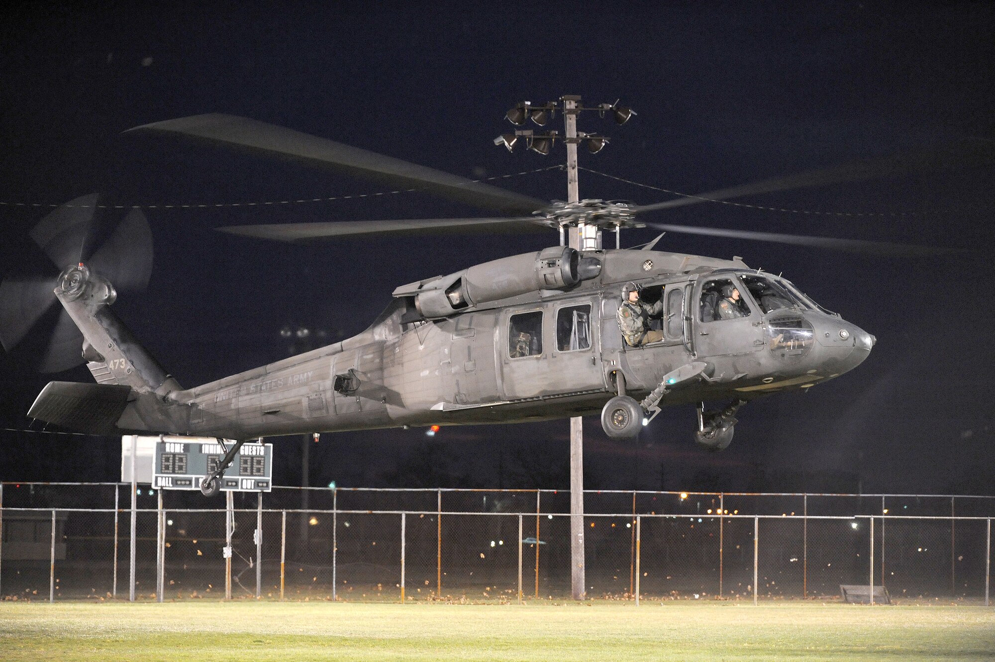 A Blackhawk helicopter carrying Santa Claus lands at a baseball field near Chapel One after the annual tree lighting ceremony. The event took place Dec. 5 at McGuire Air Force Base, N.J. (U.S. Air Force photo/Wayne Russell)