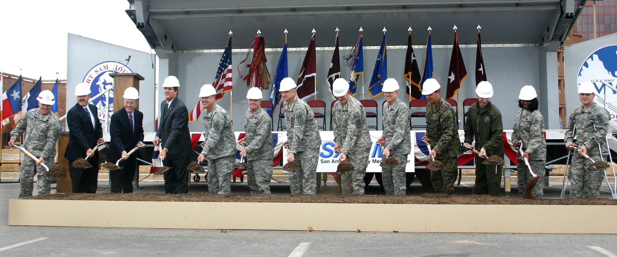 Air Force and Army military leaders, construction officials and wounded warriors break ground Dec. 8 on the $724 million San Antonio Military Medical Center project that will unify Brooke Army Medical Center, or SAMMC-North, and Wilford Hall Medical Center, or SAMMC-South. The project will expand BAMC, renovate WHMC, boost the San Antonio economy, enhance medical care and consolidate medical education and training for the Air Force, Army, Navy, Marines and Coast Guard. (U.S. Air Force Photo/Linda Frost) 
