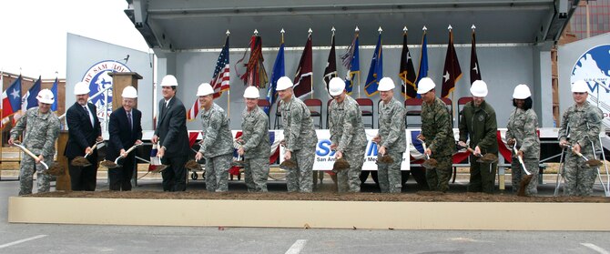 Air Force and Army military leaders, construction officials and wounded warriors break ground Dec. 8 on the $724 million San Antonio Military Medical Center project that will unify Brooke Army Medical Center, or SAMMC-North, and Wilford Hall Medical Center, or SAMMC-South. The project will expand BAMC, renovate WHMC, boost the San Antonio economy, enhance medical care and consolidate medical education and training for the Air Force, Army, Navy, Marines and Coast Guard. (U.S. Air Force Photo/Linda Frost) 