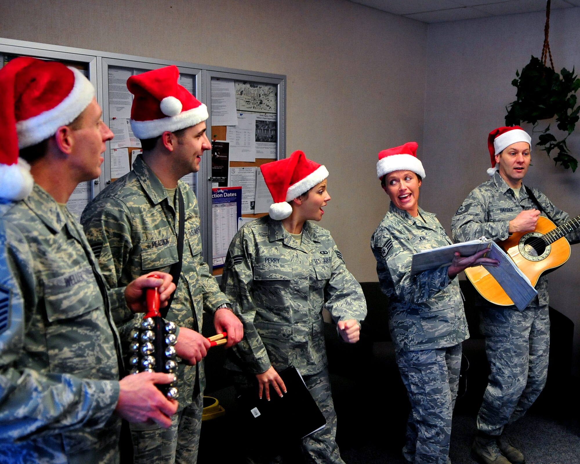 The Band of the Pacific, stationed at Elmendorf Air Force Base, performs Dec. 8 throughout Amber Hall but stopped briefly to play "Rudolph the Red-Nosed Reindeer" for the Transportation Management Office. The band was playing at Eielson Air Force Base to spread holiday cheer and kick off this holiday season. (U.S. Air Force photo by Airman 1st Class Willard E. Grande II)