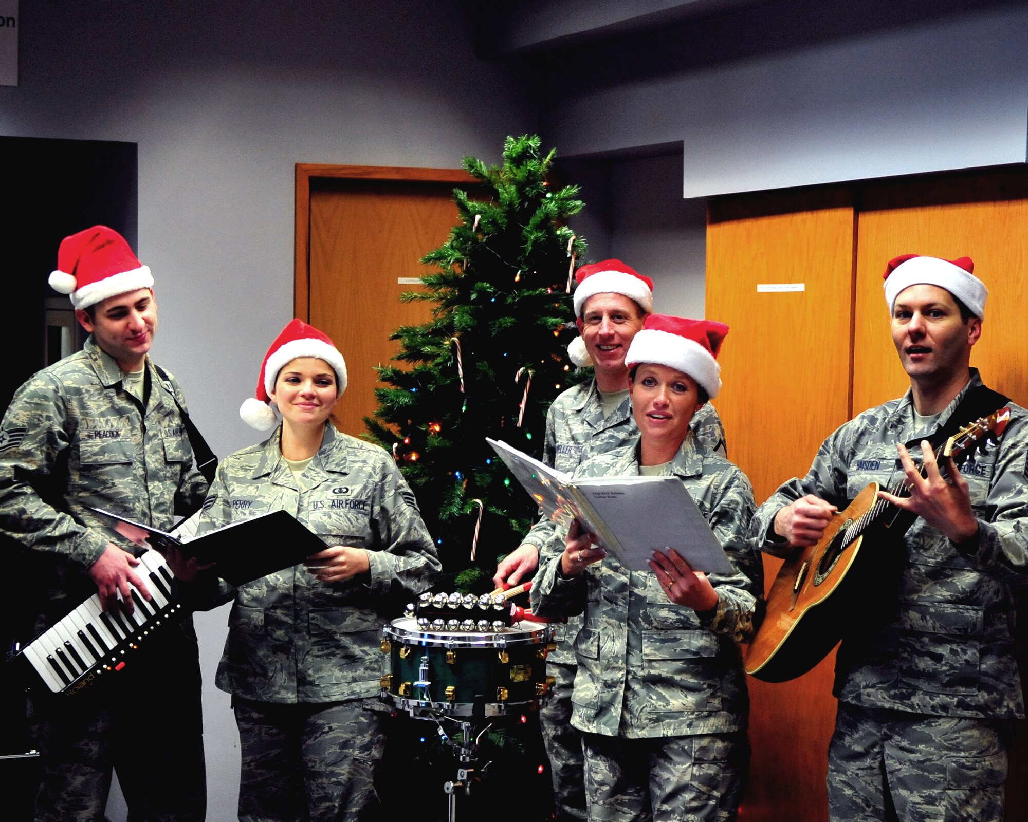 The Band of the Pacific, stationed at Elmendorf Air Force Base performs Dec. 8 throughout Amber Hall but their first stop was the 354th Comptroller Squadron. The band was at Eielson Air Force Base to spread holiday cheer and kick off this holiday season. (U.S. Air Force photo by Airman 1st Class Willard E. Grande II)